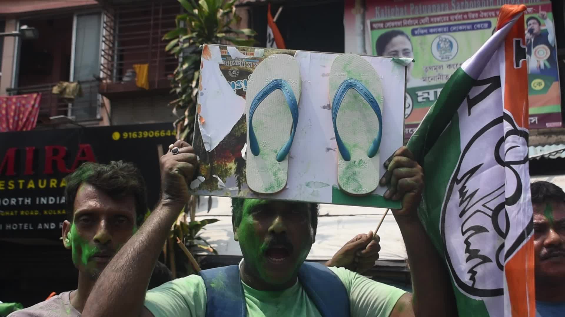 Trinamool Congress party (TMC) members cheer during Lok Sabha Election Result In Kolkata, India