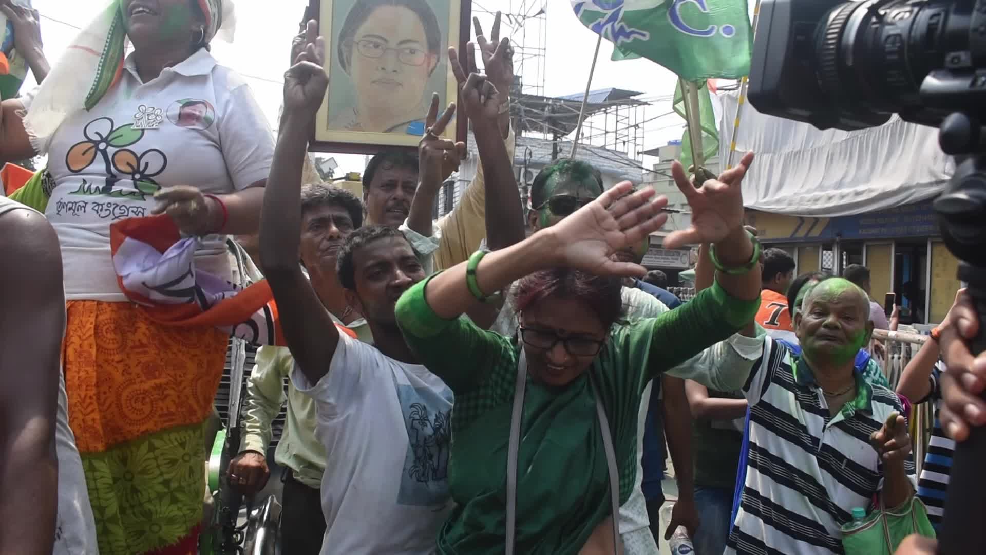 Trinamool Congress party (TMC) members cheer during Lok Sabha Election Result In Kolkata, India