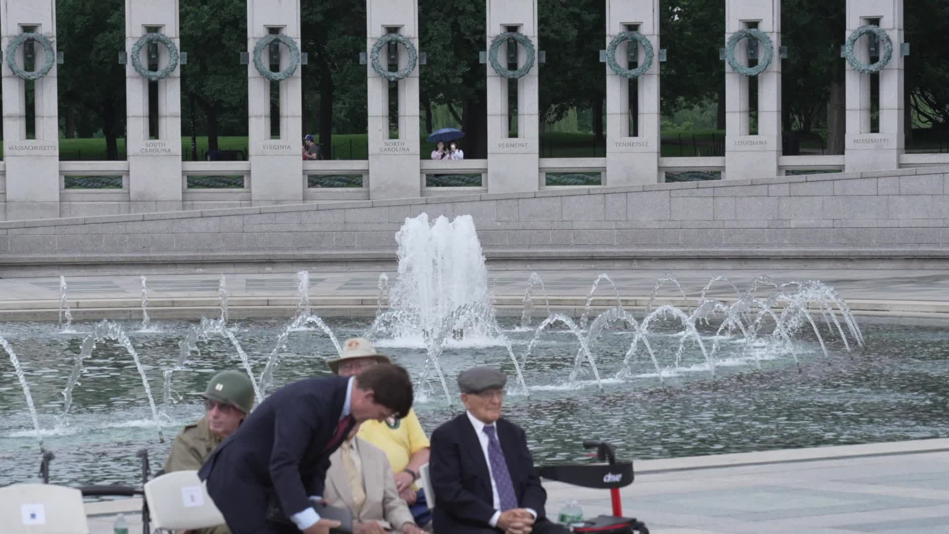 World War II and other military veterans attend a ceremony at the National World War II Memorial to commemorate the 80th anniversary of D-Day 