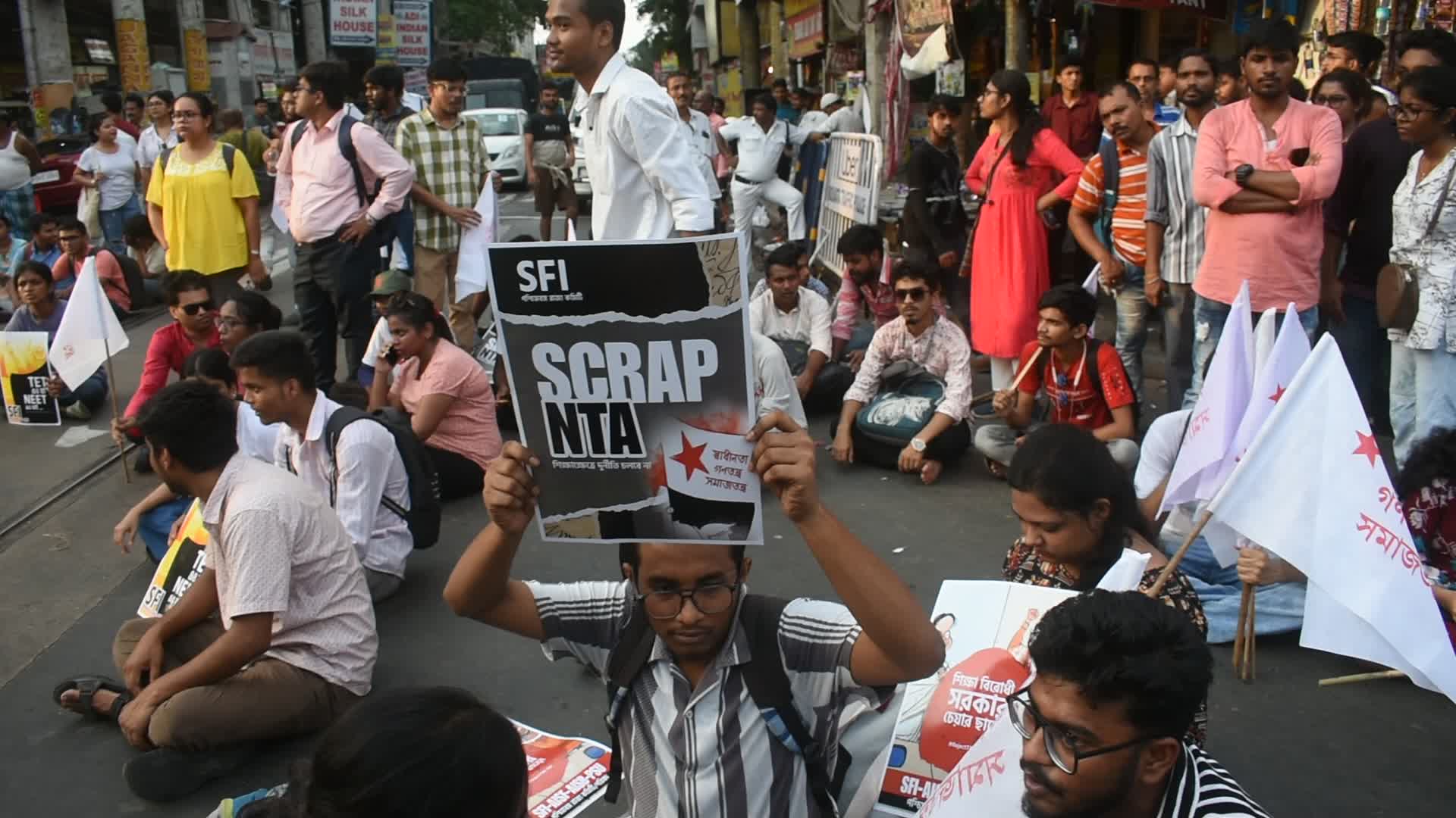 Students protest against medical entrance exam scam in India.