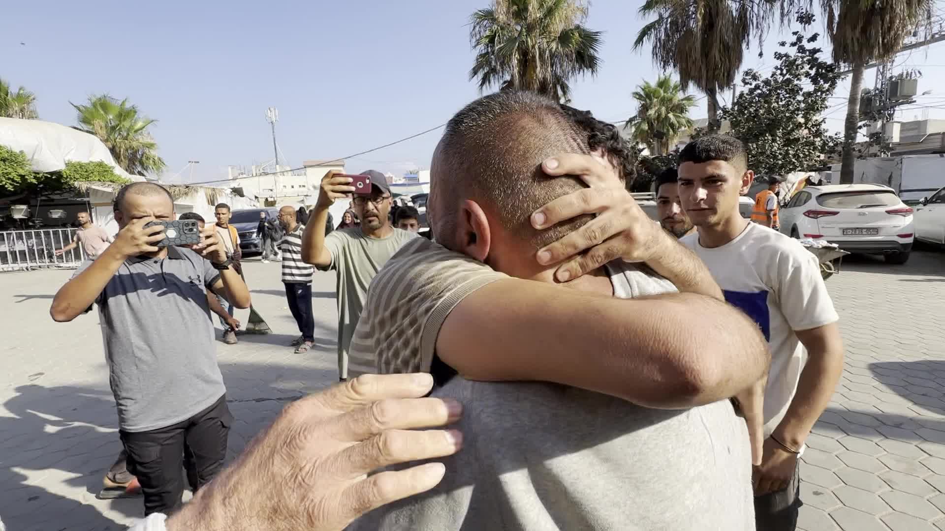 Released Palestinian Man Welcomed by Family at Gaza Hospital Amid Ongoing Conflict