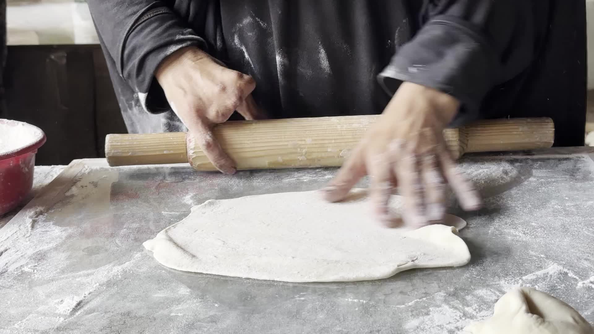 Displaced Palestinian Woman Prepares Flatbread Dough at Stall Kitchen in Central Gaza Strip Amid Ongoing Conflict