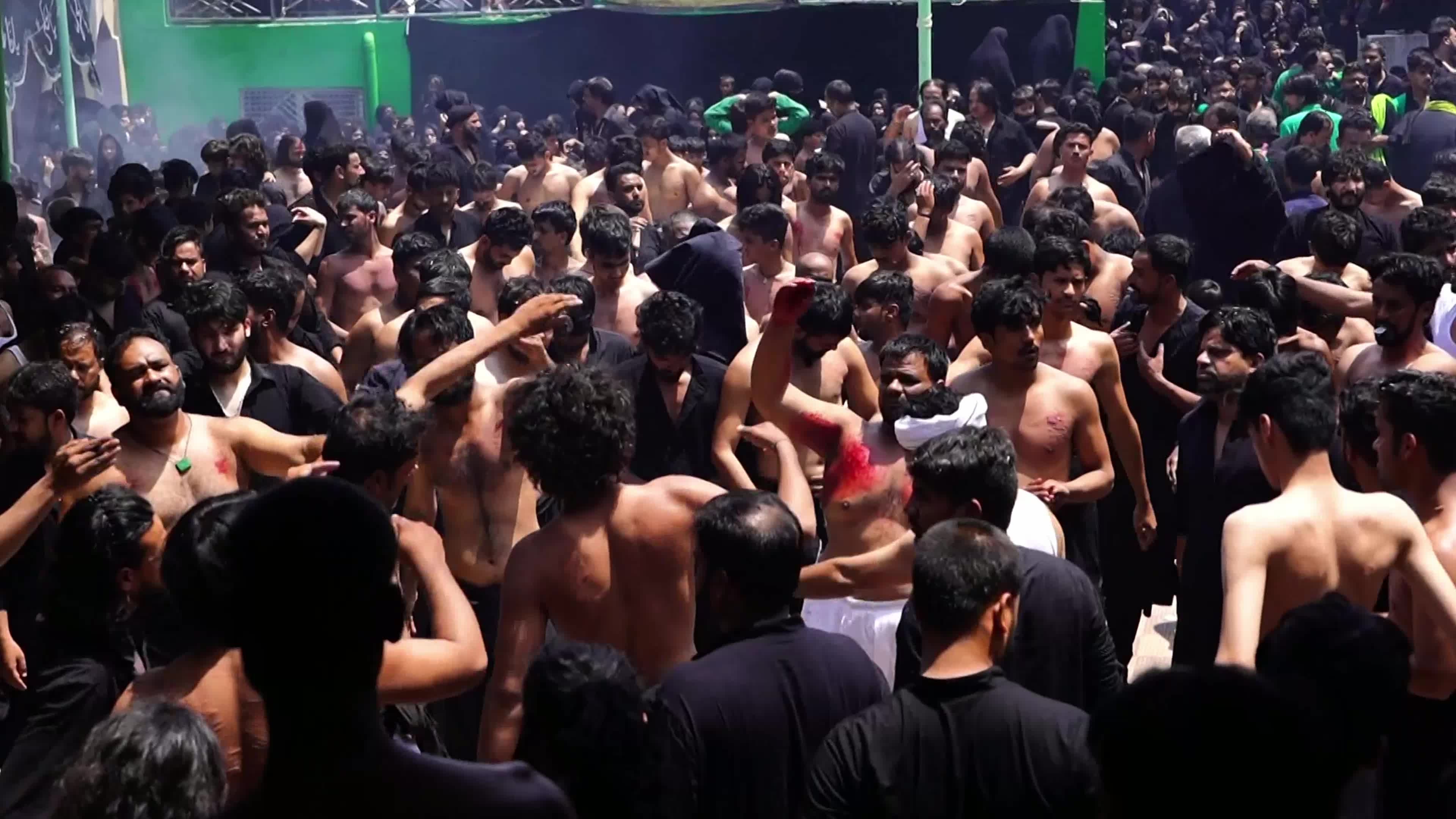 Shiite Muslim mourners flagellate themselves on the tenth day of Ashura during the Islamic month of Muharram