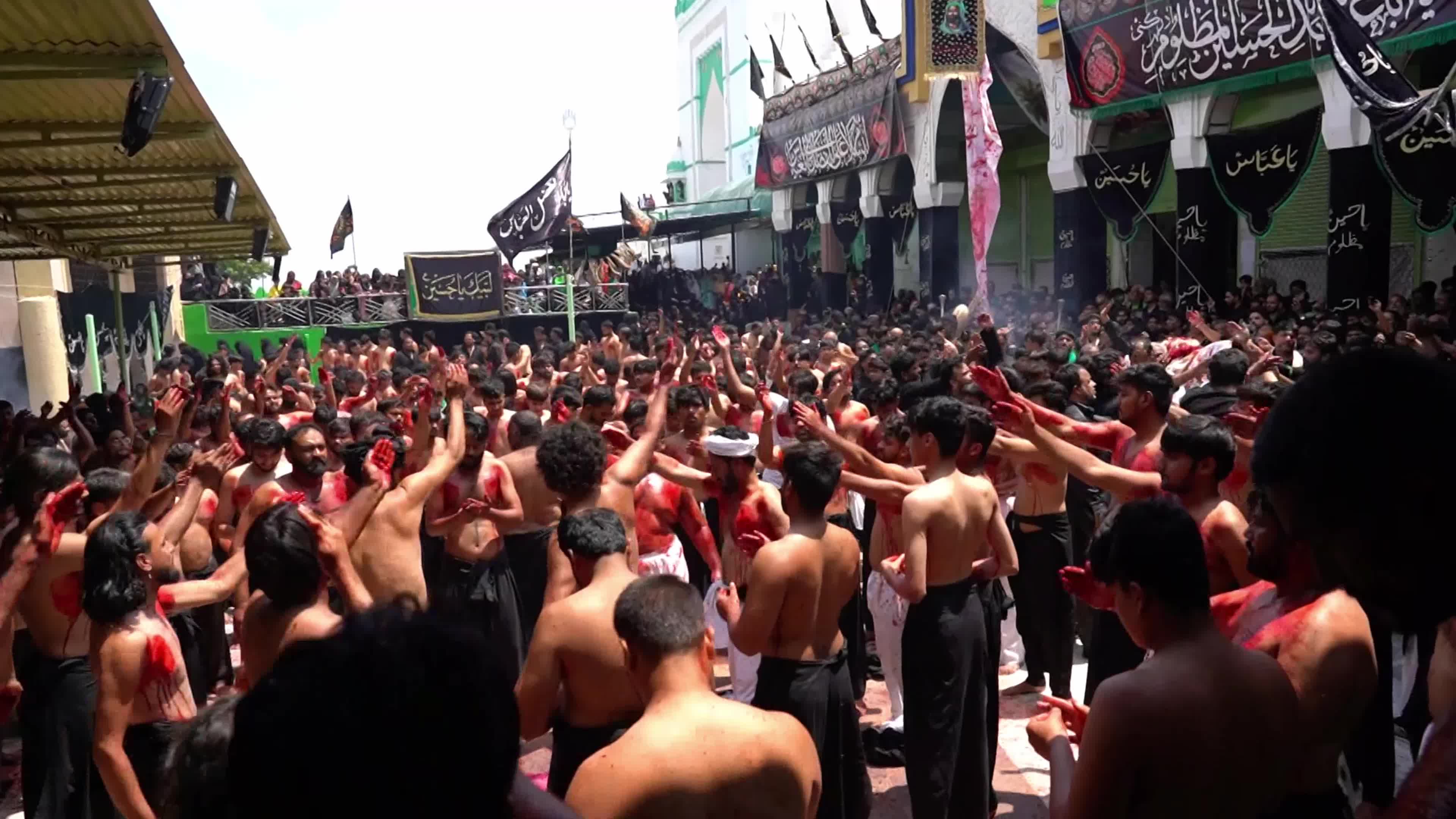 Shiite Muslim mourners flagellate themselves on the tenth day of Ashura during the Islamic month of Muharram