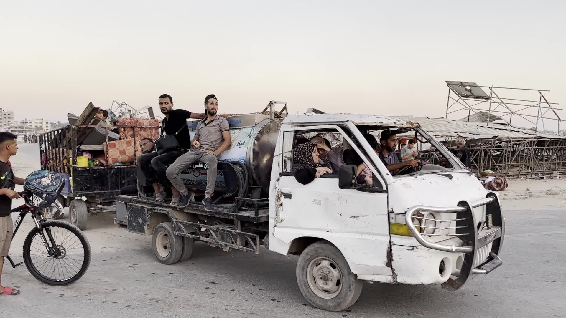 Displaced Palestinians Leave al-Bureij Refugee Camp Following Israeli Evacuation Order Amid Ongoing Israel-Hamas Conflict