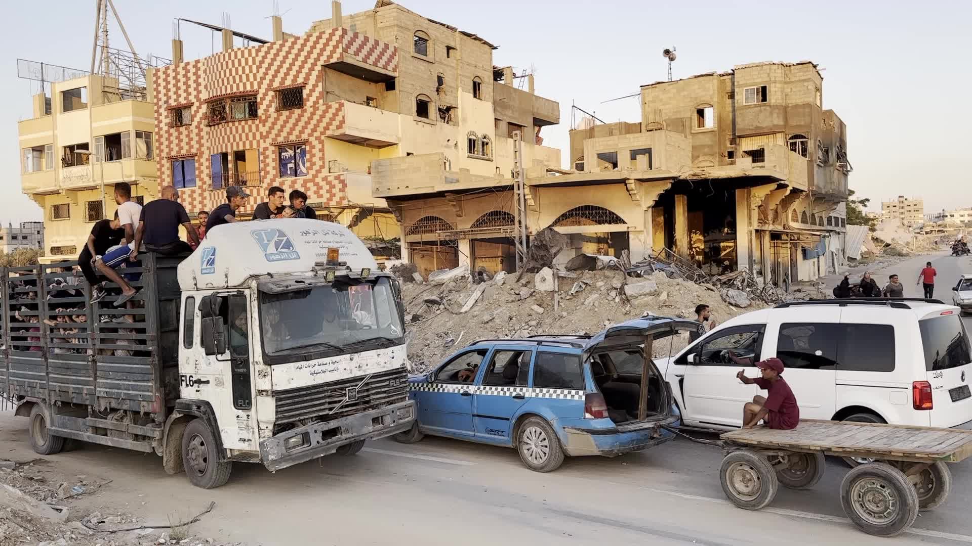 Displaced Palestinians Leave al-Bureij Refugee Camp Following Israeli Evacuation Order Amid Ongoing Israel-Hamas Conflict