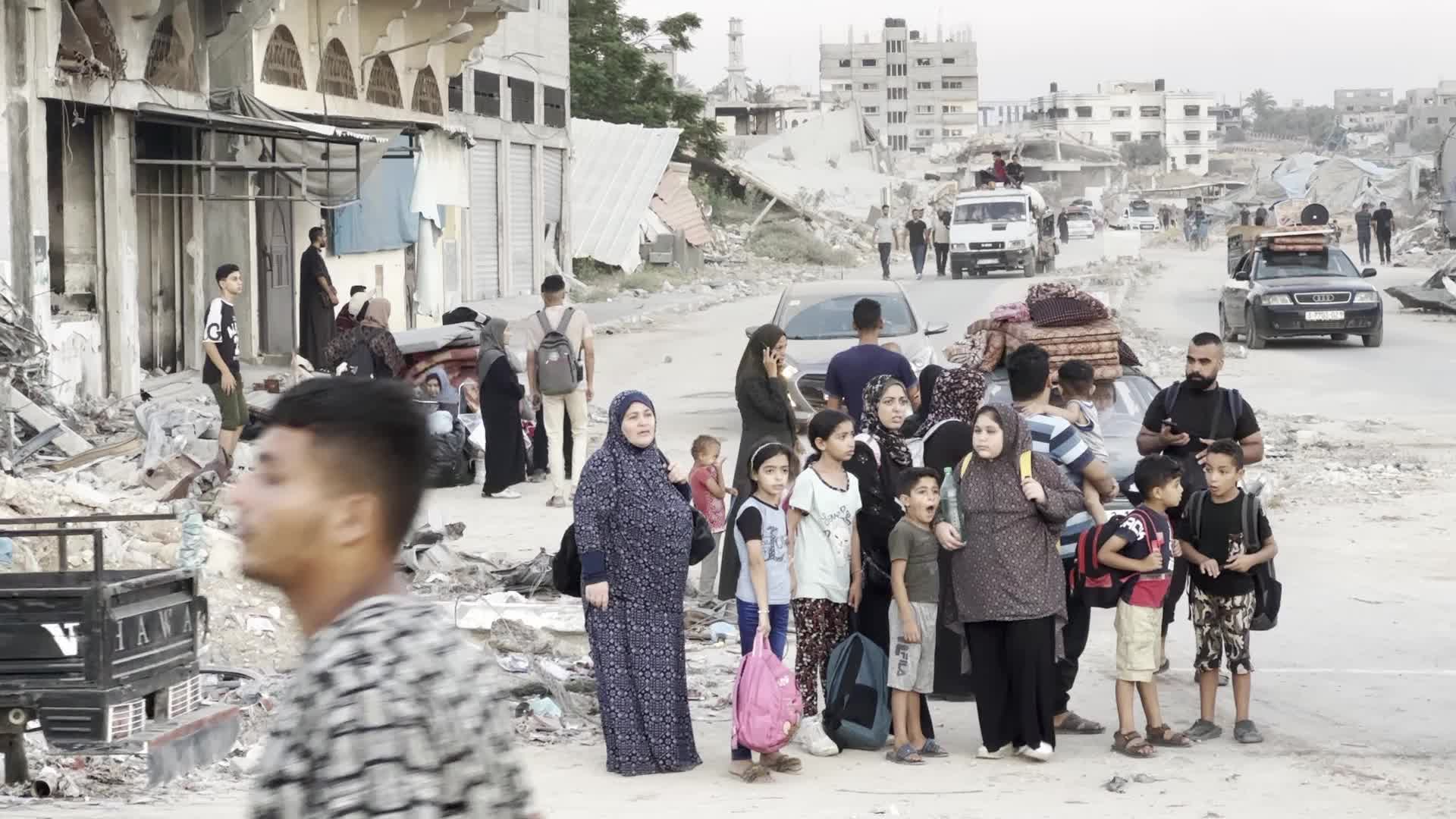 Displaced Palestinians Leave al-Bureij Refugee Camp Following Israeli Evacuation Order Amid Ongoing Israel-Hamas Conflict