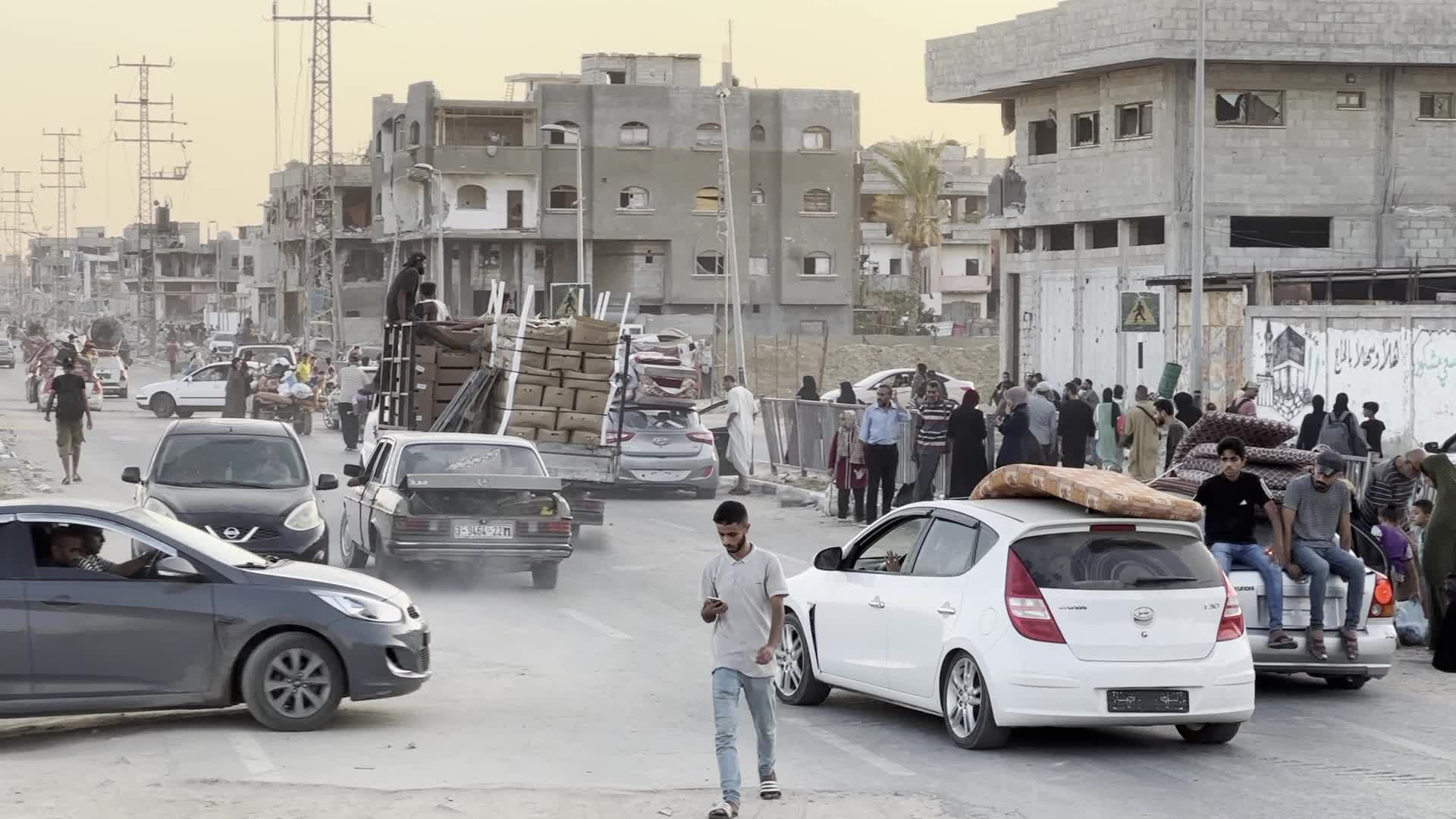 Displaced Palestinians Leave al-Bureij Refugee Camp Following Israeli Evacuation Order Amid Ongoing Israel-Hamas Conflict