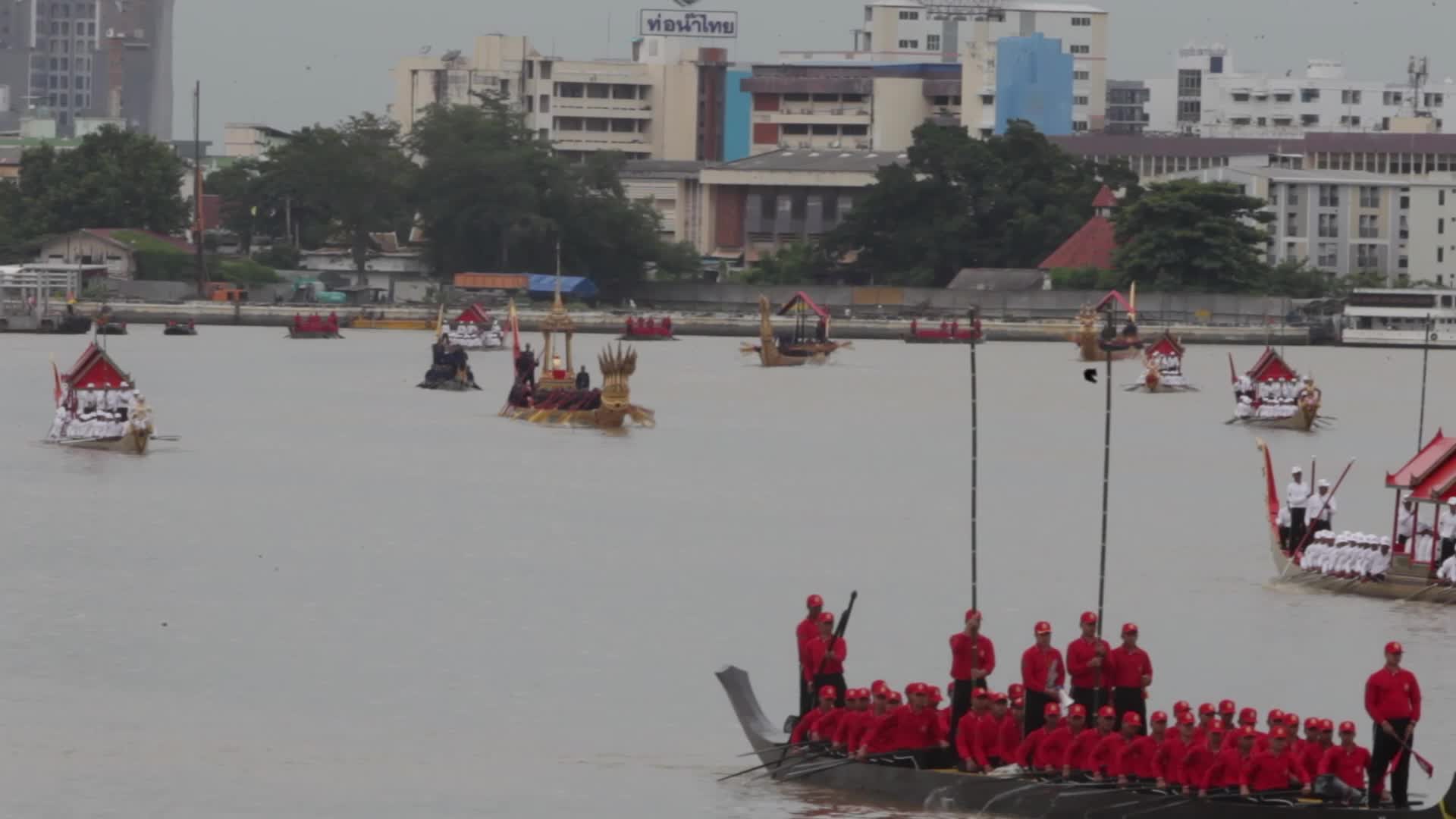 Thai Oarsmen Row Royal Barges During Practice Procession on Chao Phraya River