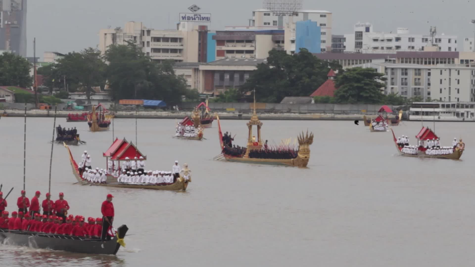 Thai Oarsmen Row Royal Barges During Practice Procession on Chao Phraya River