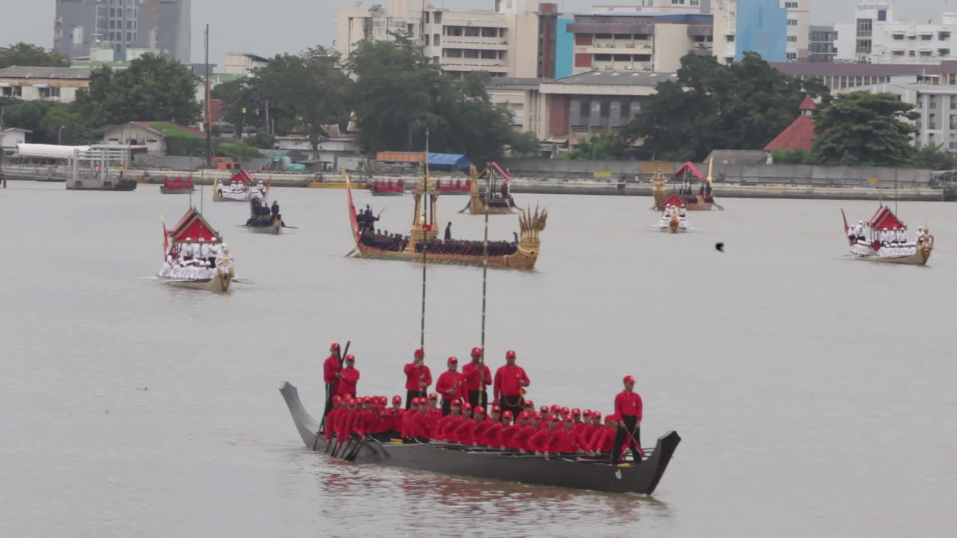 Thai Oarsmen Row Royal Barges During Practice Procession on Chao Phraya River