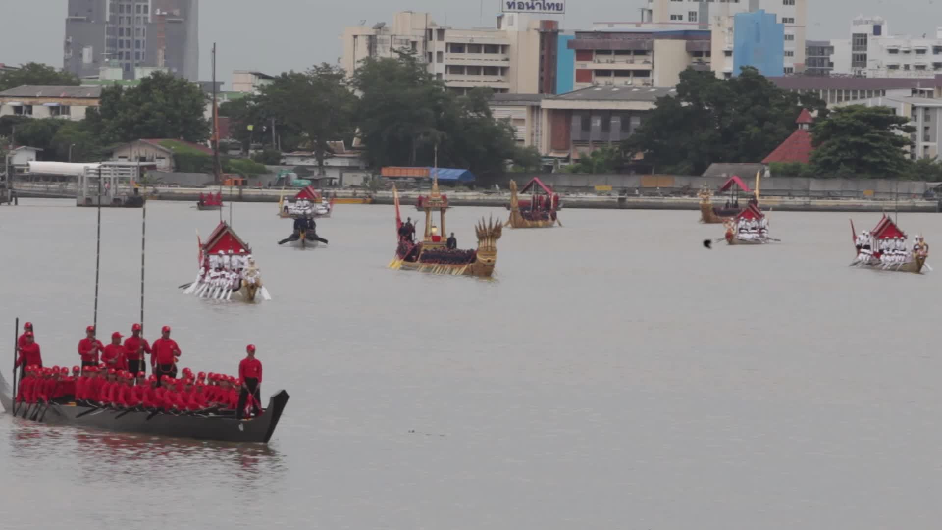 Thai Oarsmen Row Royal Barges During Practice Procession on Chao Phraya River