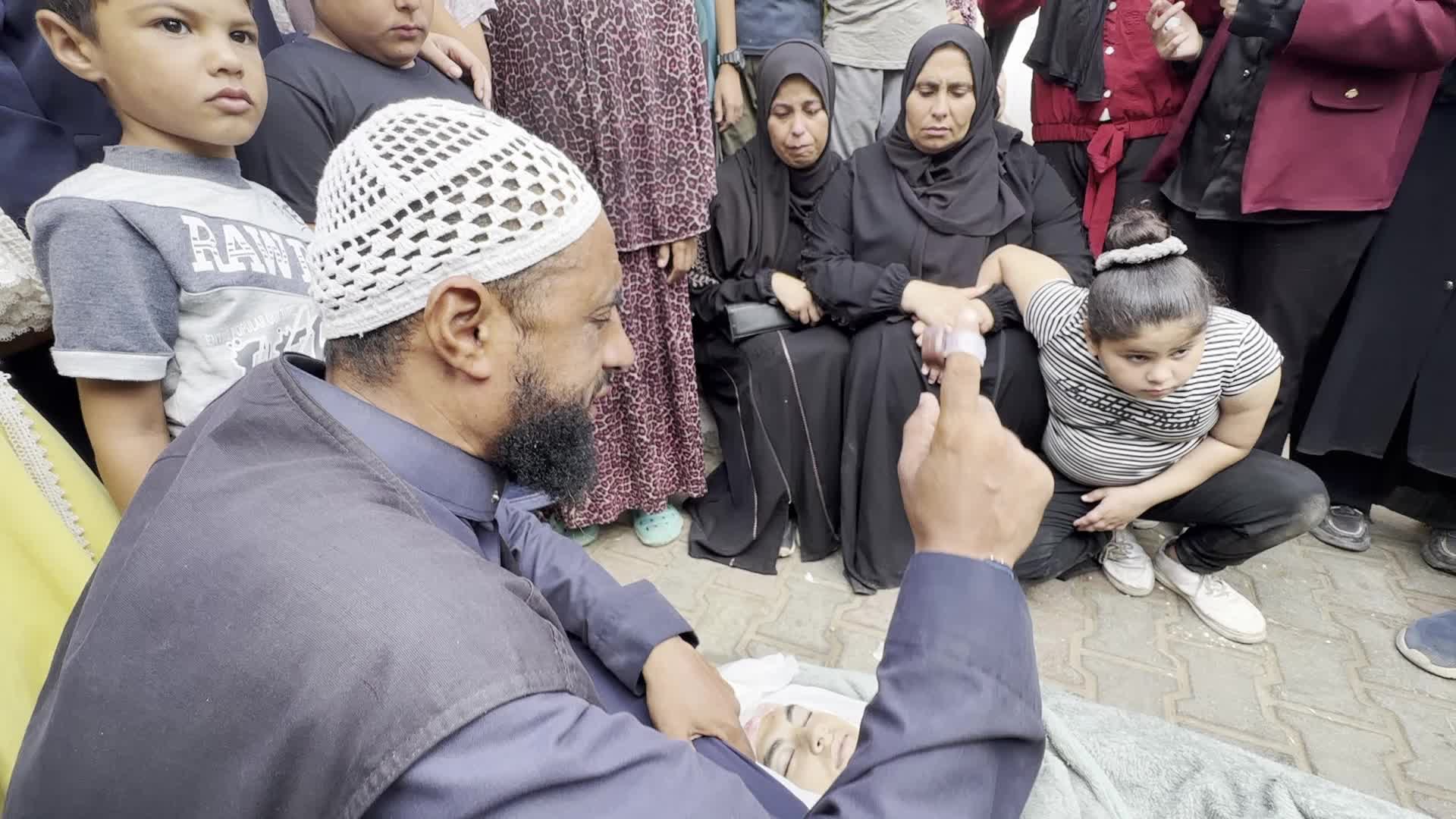 Palestinians Mourn Family Member After Overnight Israeli Strike on Temporary Shelters in Gaza Hospital Courtyard