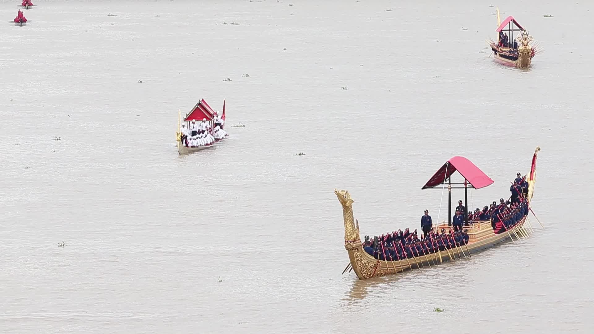 Thai Oarsmen Row Royal Barges on Chao Phraya River During Practice Procession for Upcoming Royal Kathin Ceremony