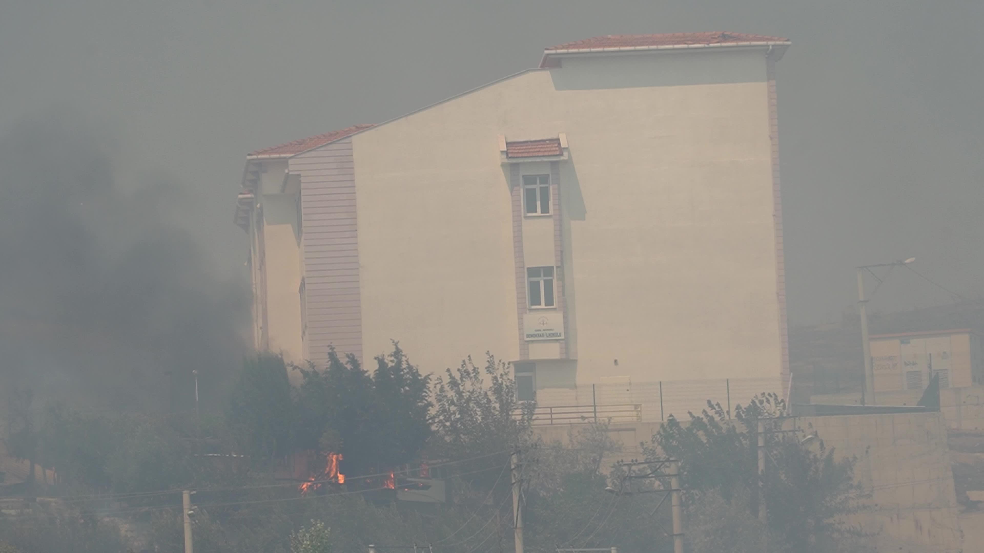 Wildfire has reached into the residential area, Bayrakli, Izmir, Turkey