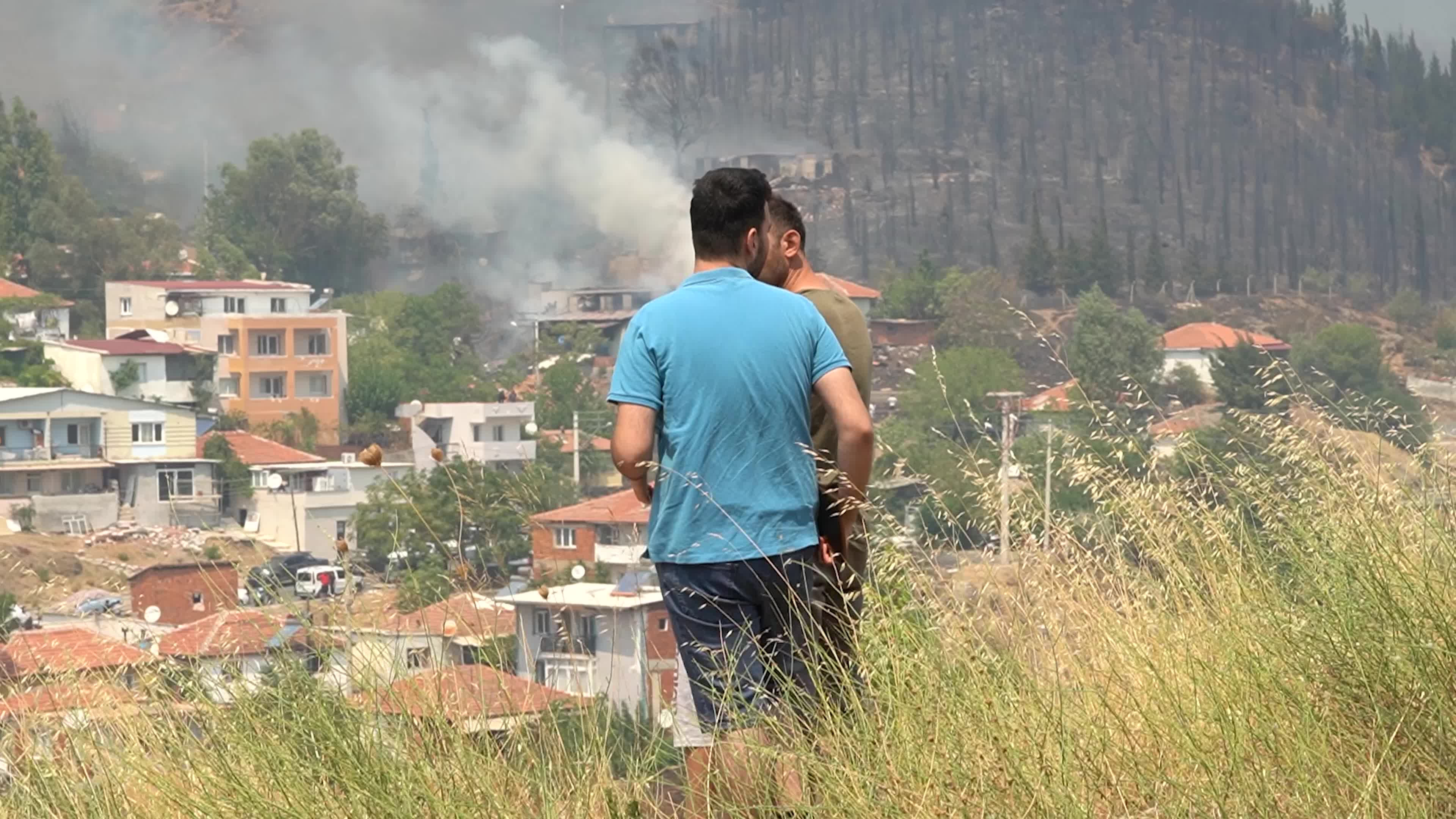 Wildfire has reached into the residential area, Bayrakli, Izmir, Turkey