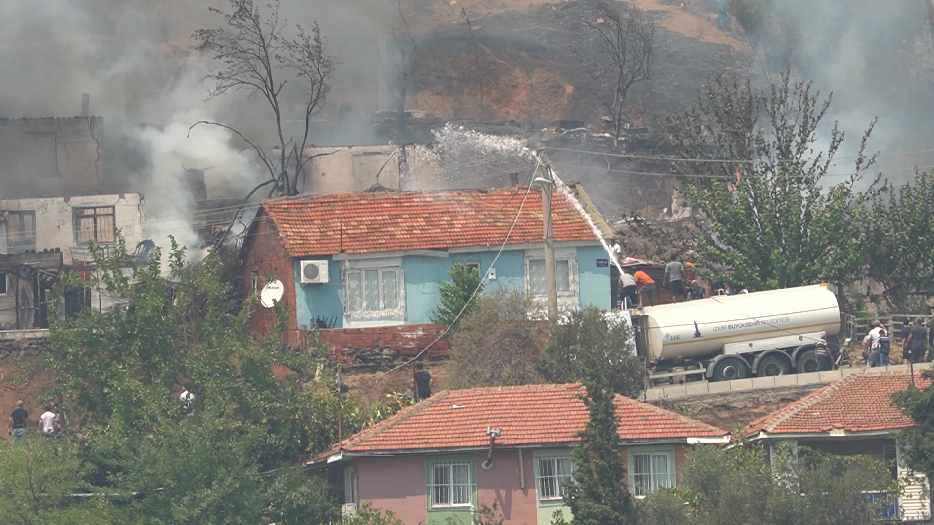 Wildfire has reached into the residential area, Bayrakli, Izmir, Turkey