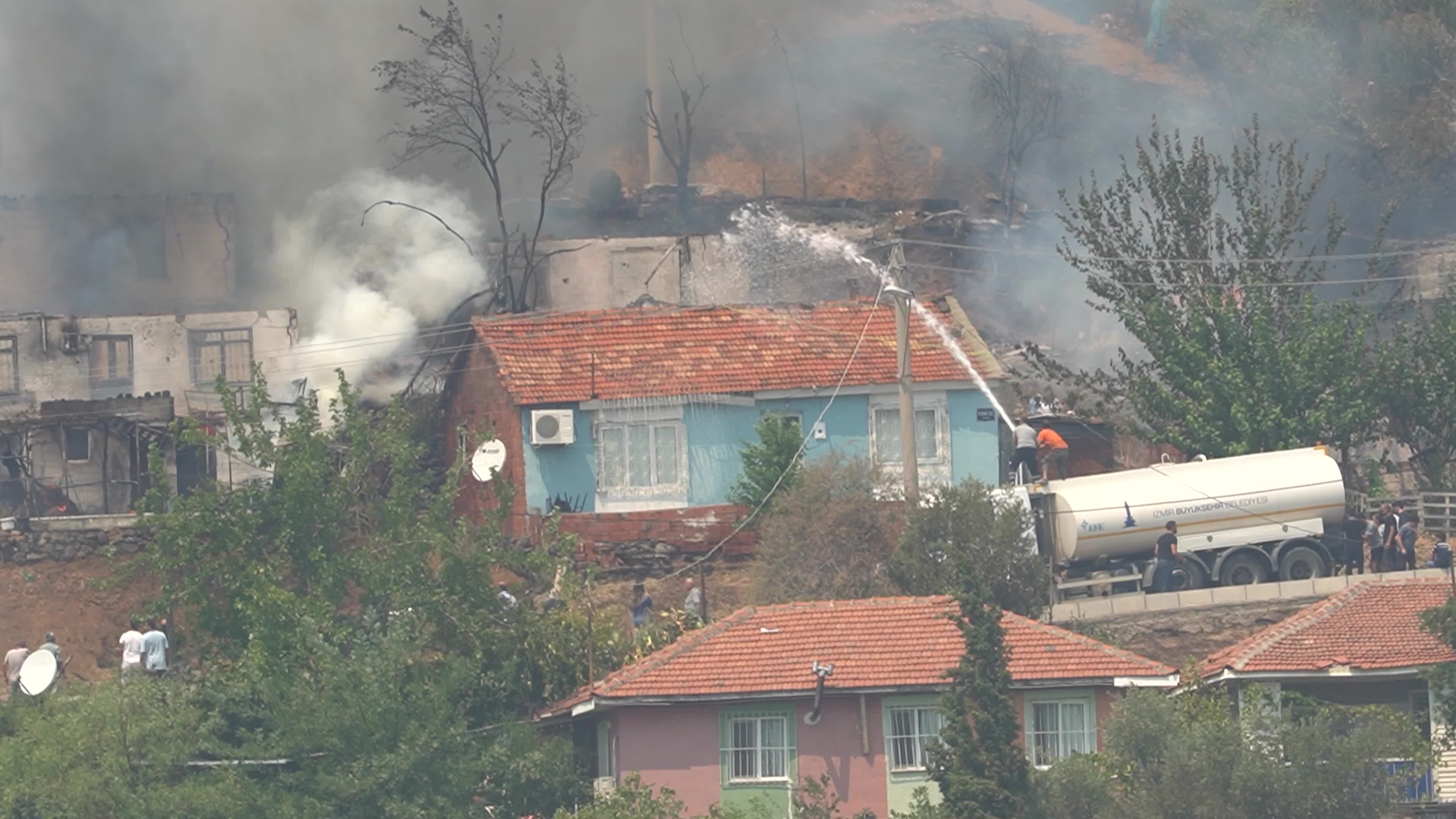 Wildfire has reached into the residential area, Bayrakli, Izmir, Turkey