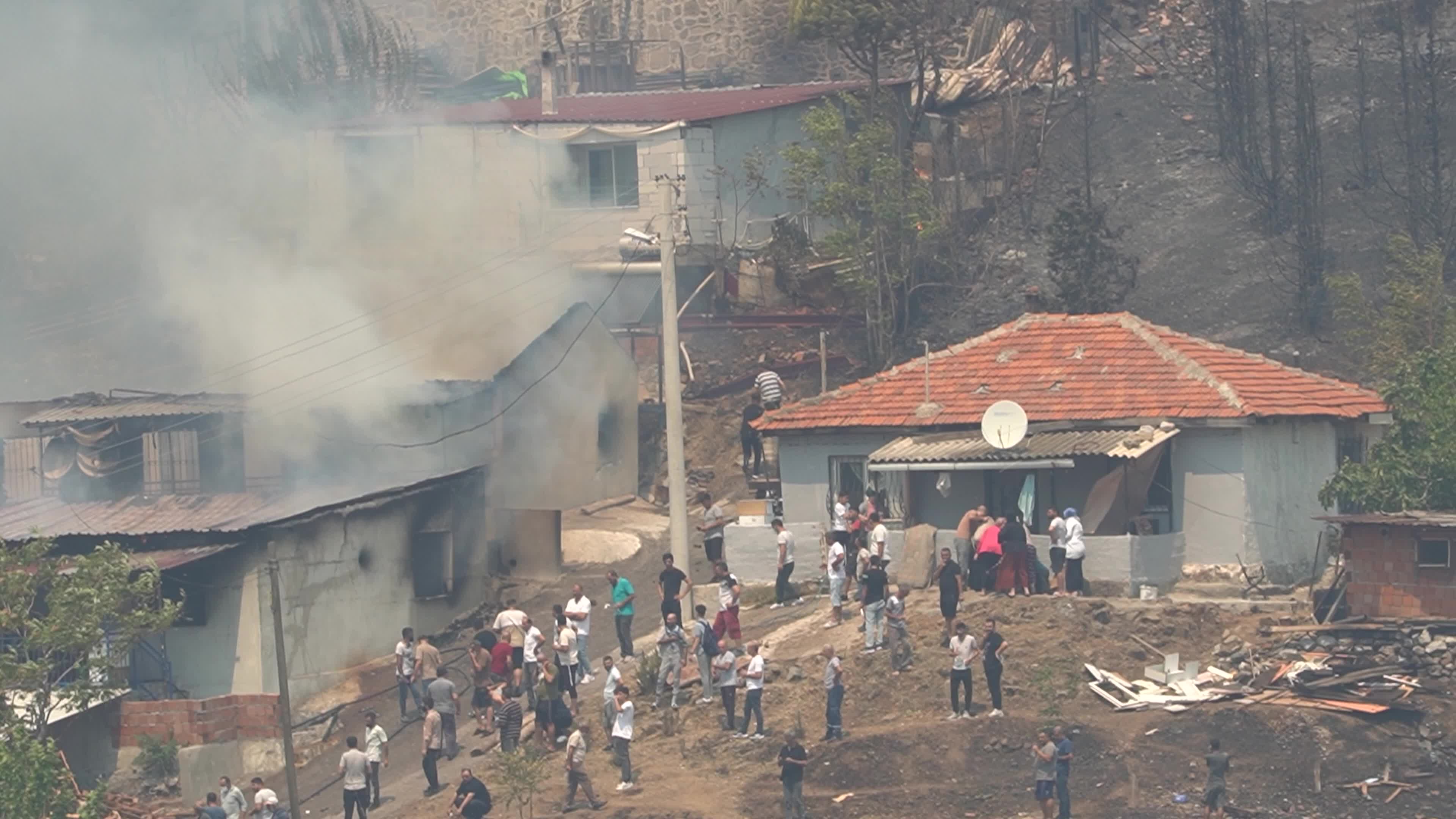 Wildfire has reached into the residential area, Bayrakli, Izmir, Turkey