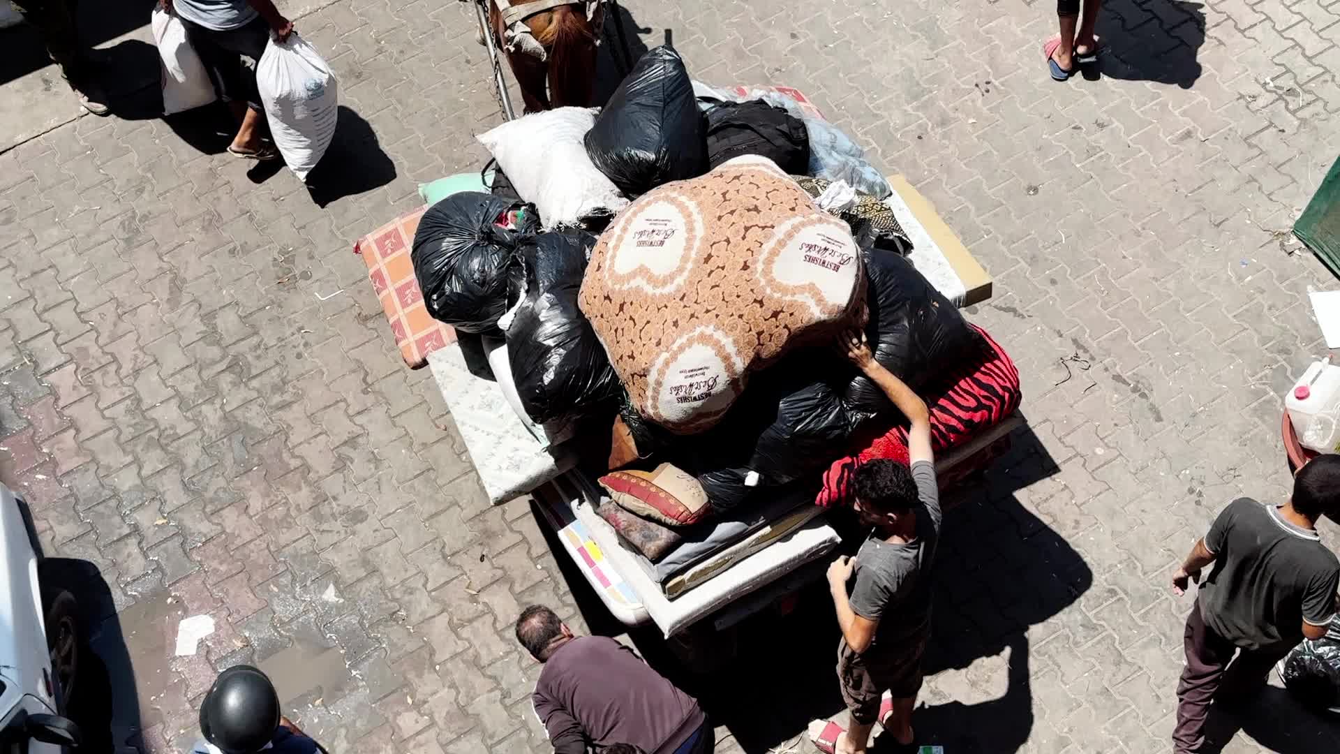 Palestinians Flee With Belongings in Deir el-Balah, Gaza, Amid Ongoing Israel-Hamas Conflict 