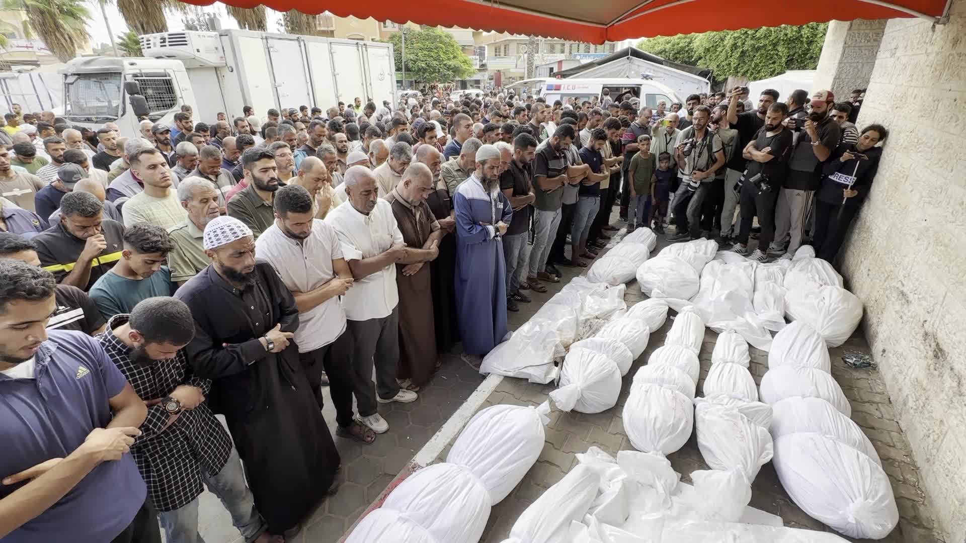 Palestinians Mourn Relatives Killed in Israeli Strike at Al-Aqsa Martyrs Hospital in Gaza