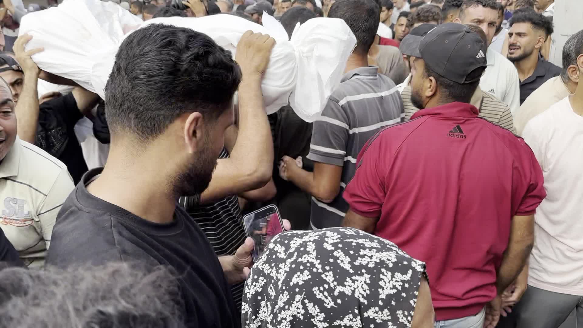 Palestinians Mourn Relatives Killed in Israeli Strike at Al-Aqsa Martyrs Hospital in Gaza