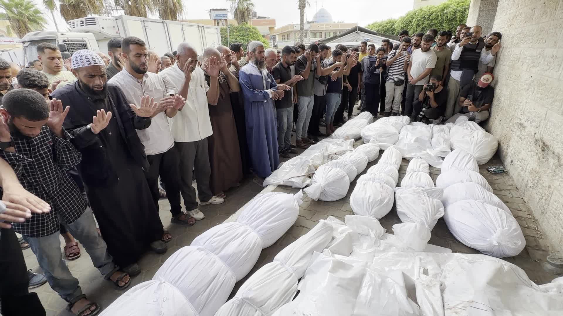 Palestinians Mourn Relatives Killed in Israeli Strike at Al-Aqsa Martyrs Hospital in Gaza
