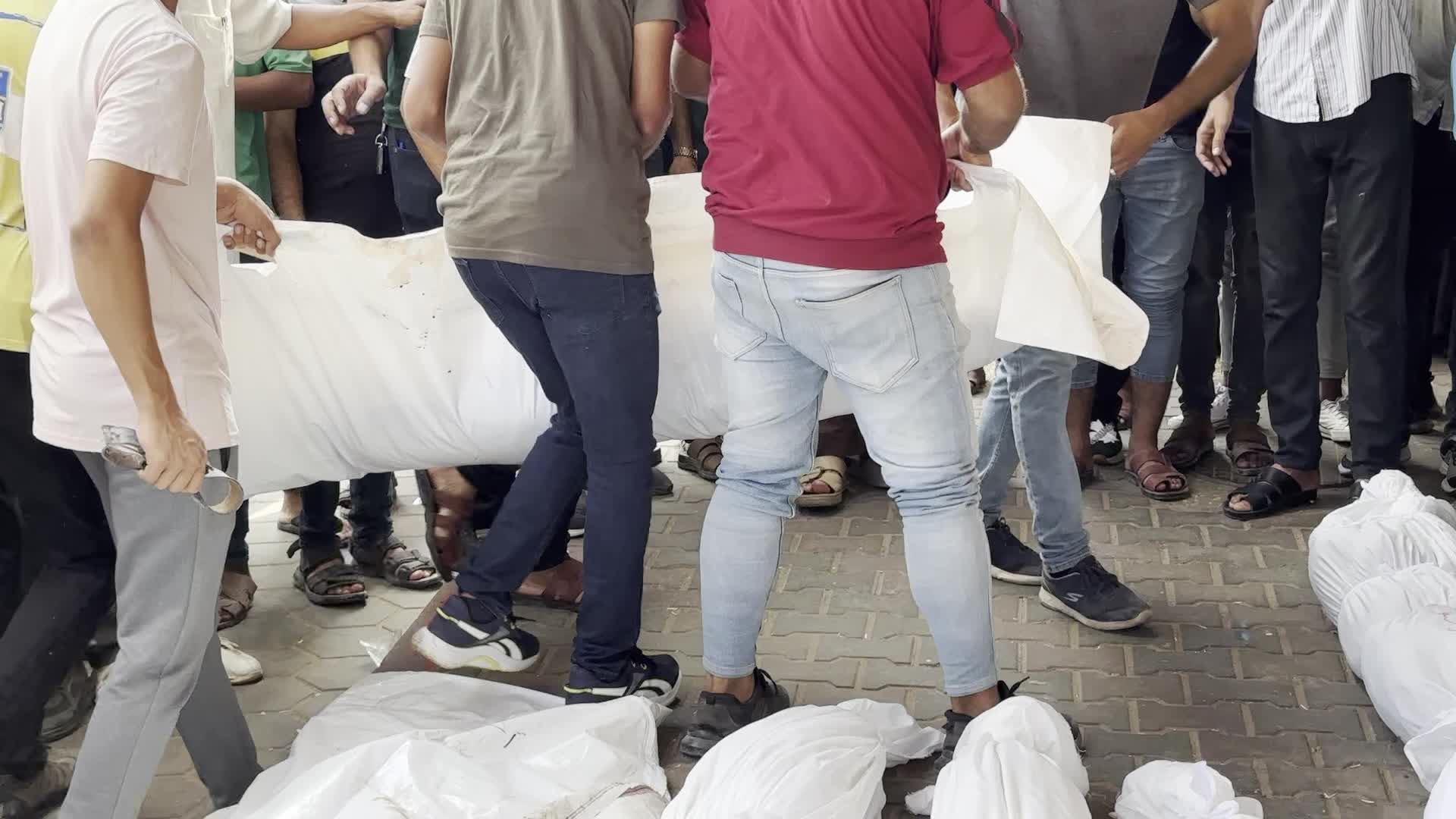 Palestinians Mourn Relatives Killed in Israeli Strike at Al-Aqsa Martyrs Hospital in Gaza