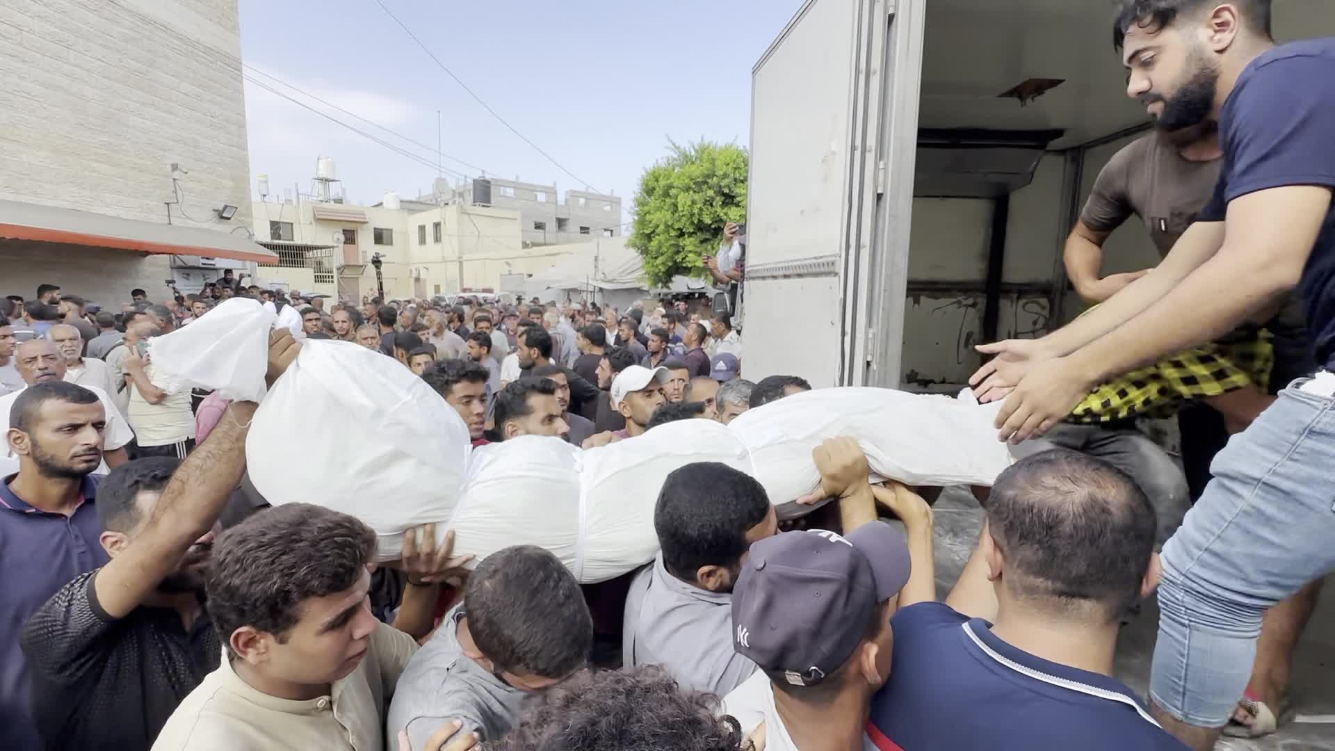 Palestinians Mourn Relatives Killed in Israeli Strike at Al-Aqsa Martyrs Hospital in Gaza