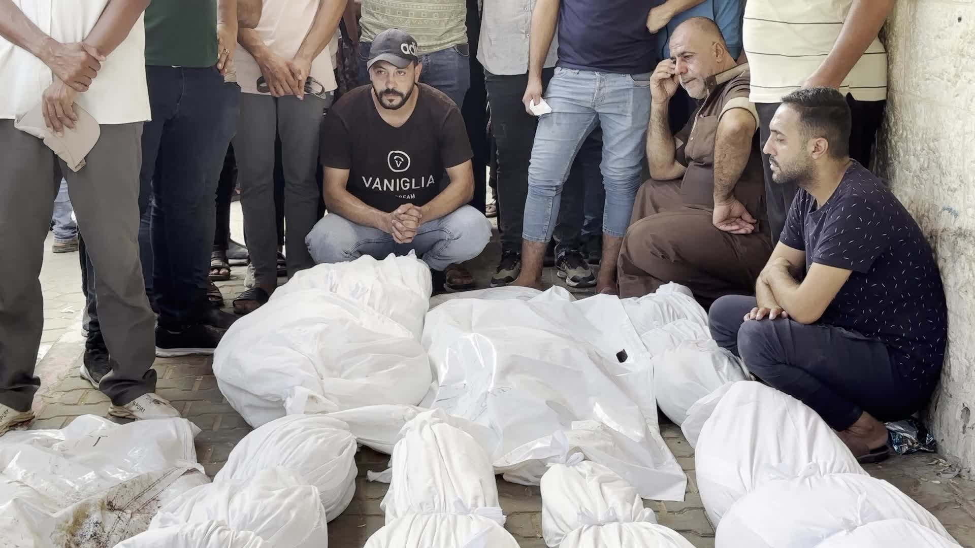 Palestinians Mourn Relatives Killed in Israeli Strike at Al-Aqsa Martyrs Hospital in Gaza