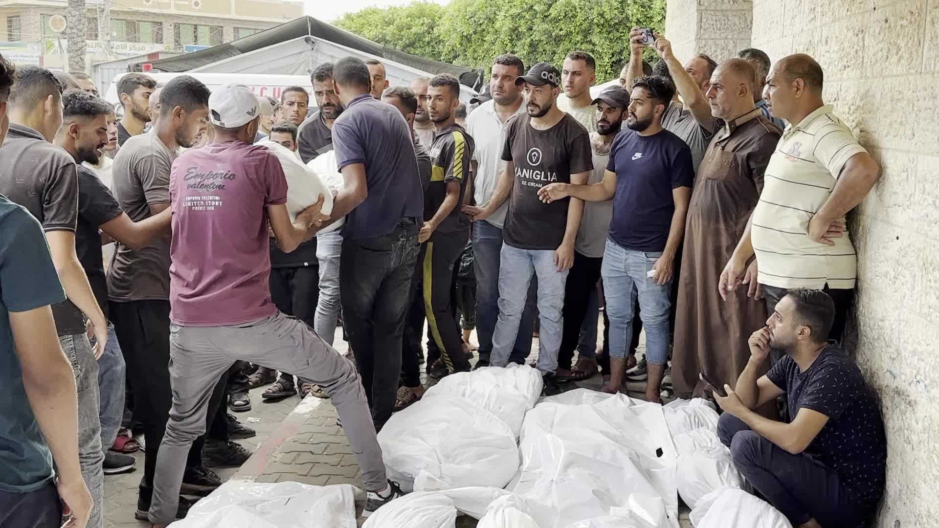 Palestinians Mourn Relatives Killed in Israeli Strike at Al-Aqsa Martyrs Hospital in Gaza