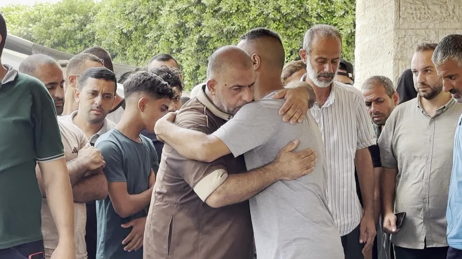 Palestinians Mourn Relatives Killed in Israeli Strike at Al-Aqsa Martyrs Hospital in Gaza