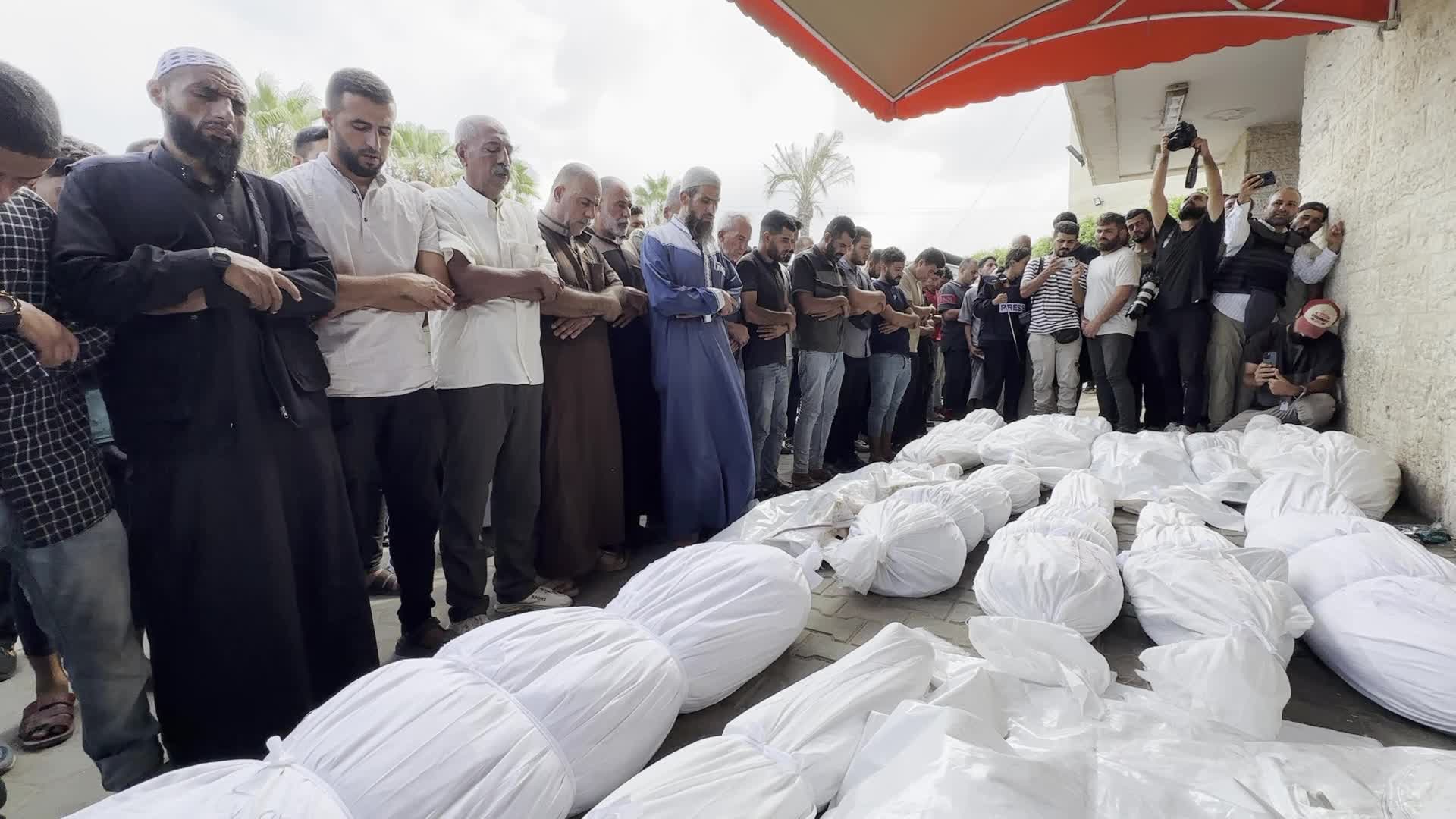 Palestinians Mourn Relatives Killed in Israeli Strike at Al-Aqsa Martyrs Hospital in Gaza