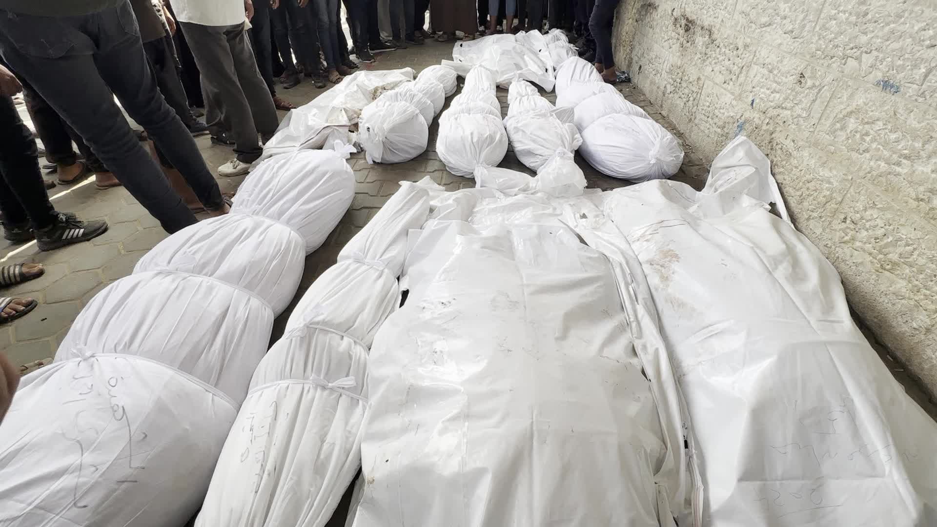 Palestinians Mourn Relatives Killed in Israeli Strike at Al-Aqsa Martyrs Hospital in Gaza
