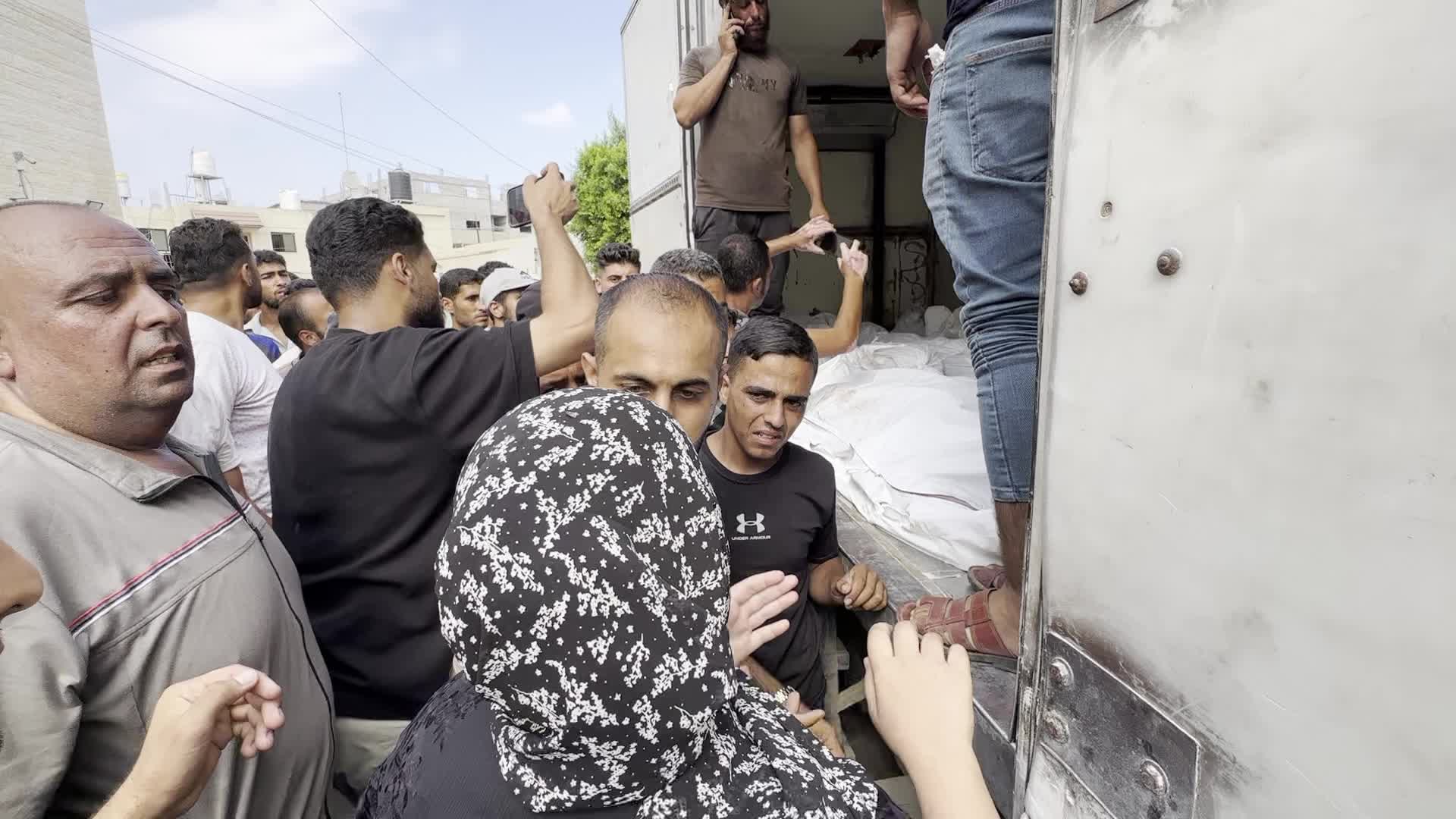 Palestinians Mourn Relatives Killed in Israeli Strike at Al-Aqsa Martyrs Hospital in Gaza