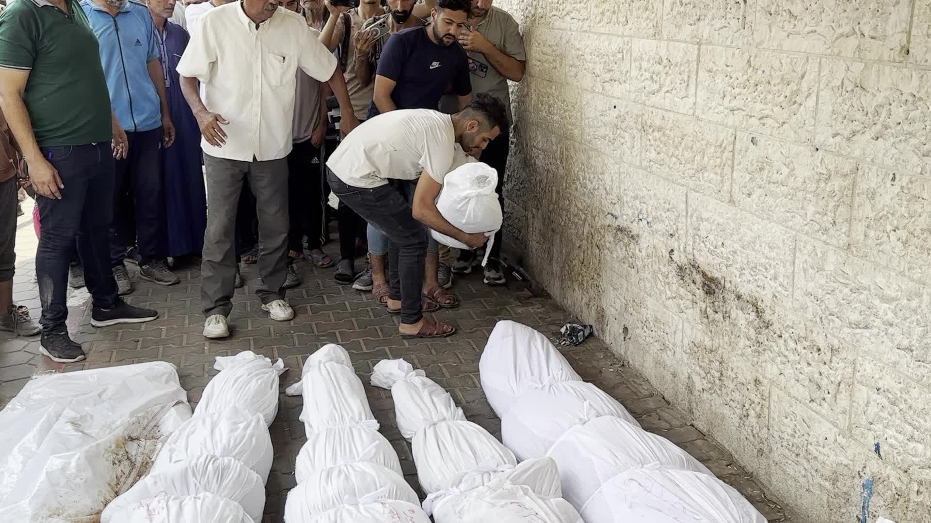 Palestinians Mourn Relatives Killed in Israeli Strike at Al-Aqsa Martyrs Hospital in Gaza
