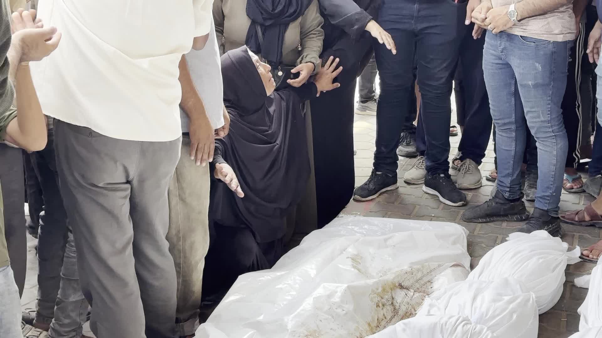 Palestinians Mourn Relatives Killed in Israeli Strike at Al-Aqsa Martyrs Hospital in Gaza
