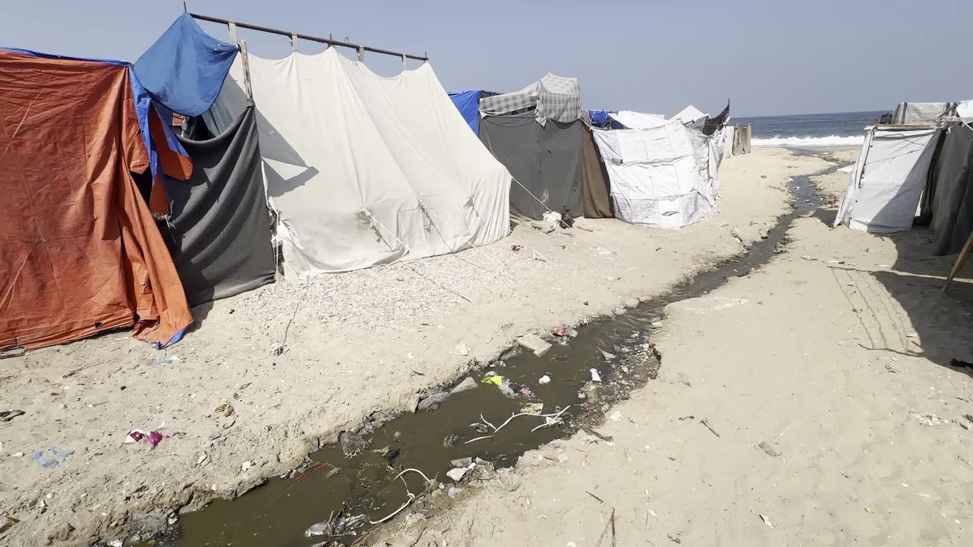 Displaced Palestinians Near Raw Sewage at Camp in Deir al-Balah, Gaza Strip