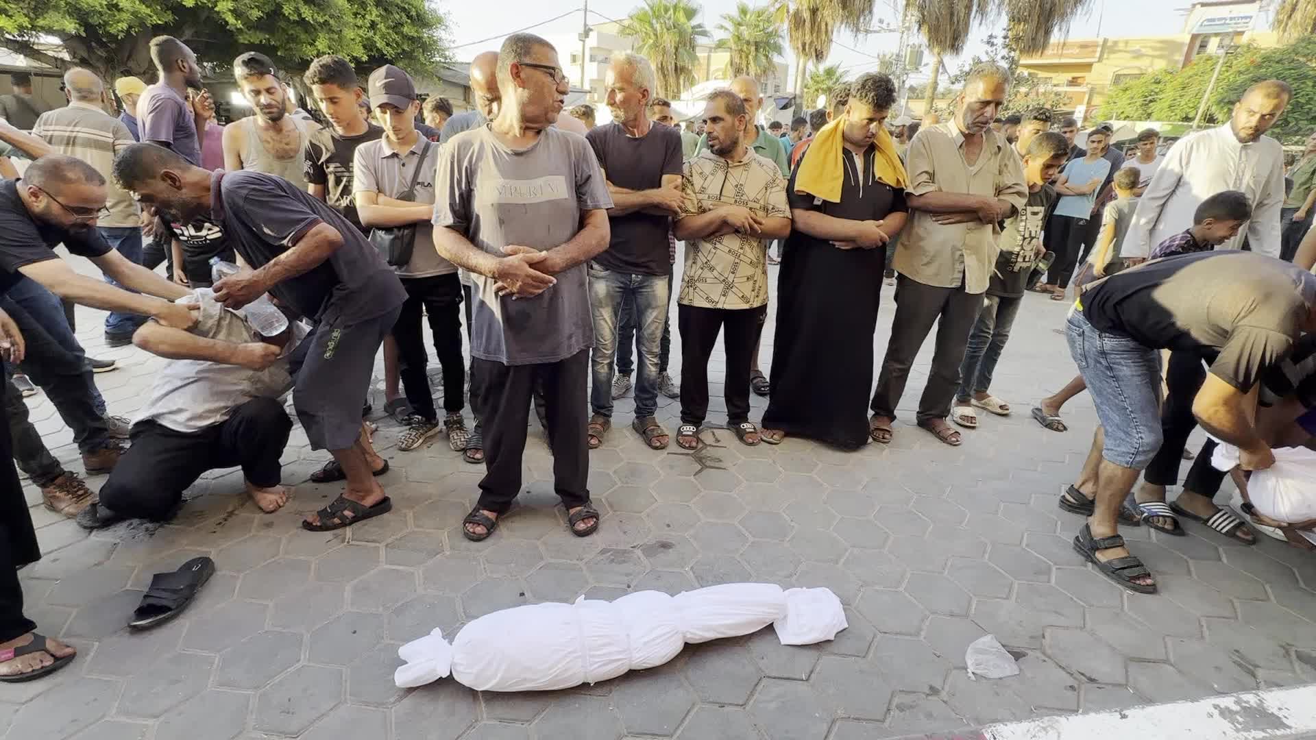 Palestinians Mourn Relatives Killed in Israeli Strike at Al-Aqsa Martyrs Hospital