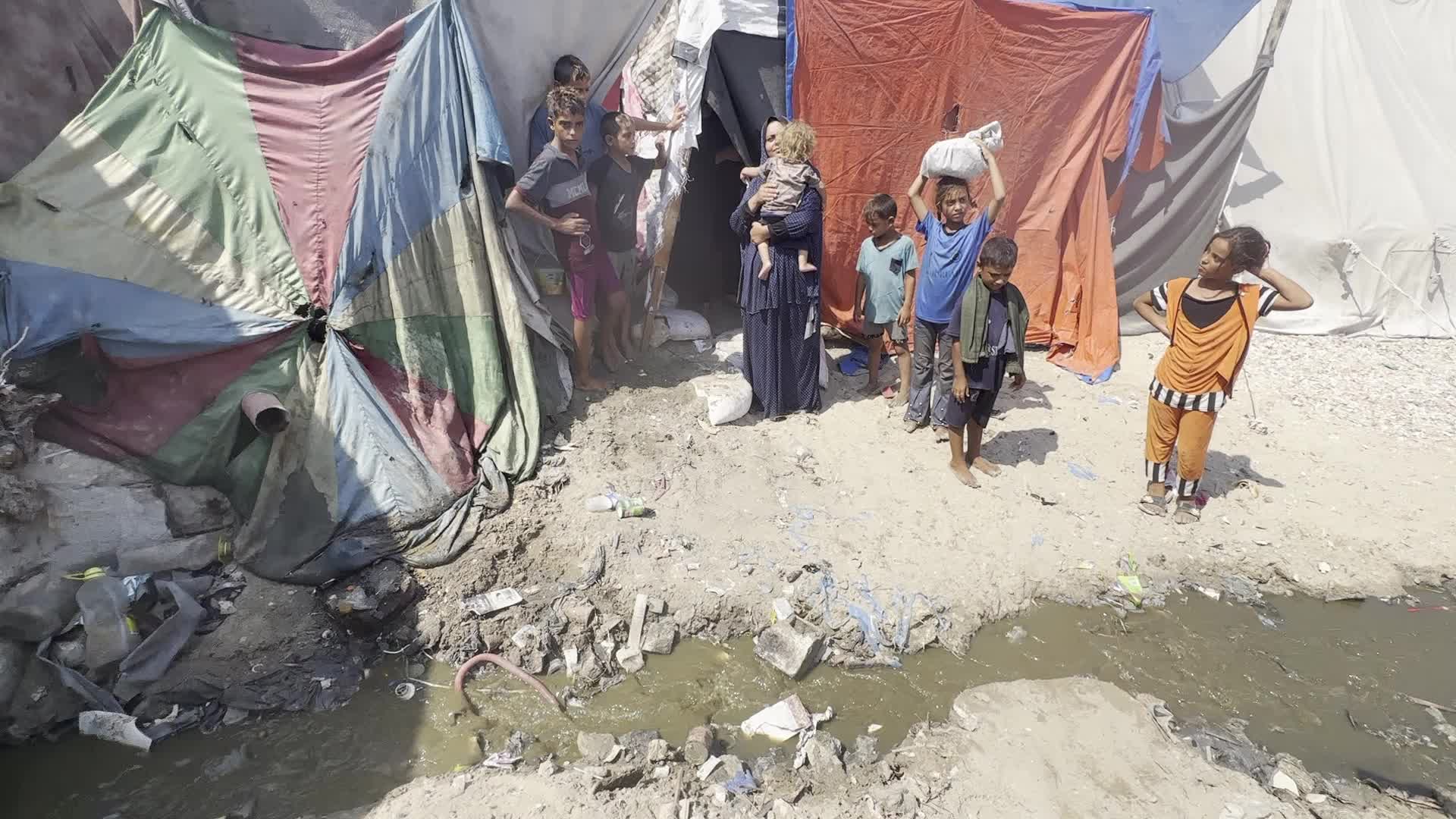 Displaced Palestinians Near Raw Sewage at Camp in Deir al-Balah, Gaza Strip