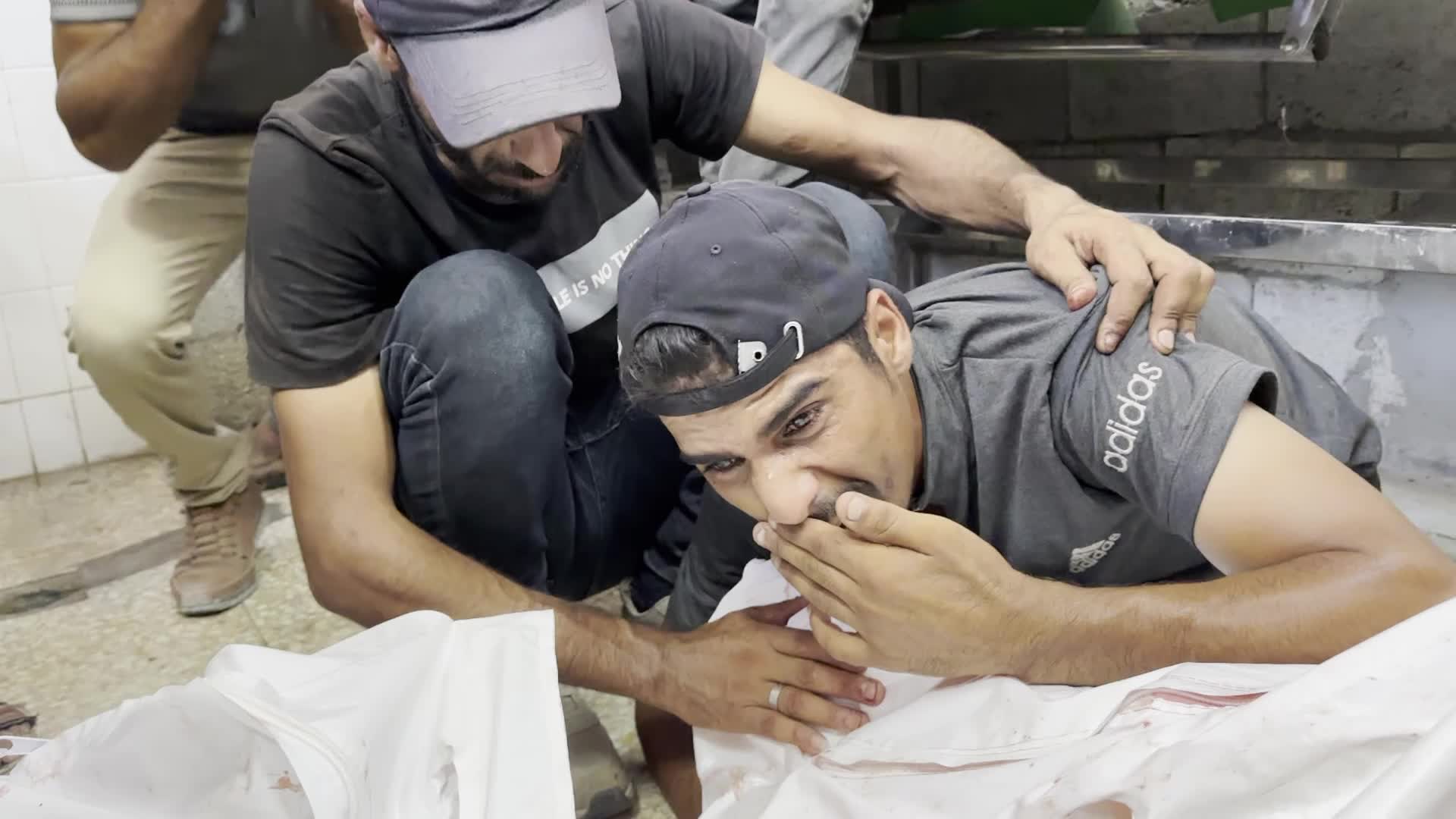 Palestinians Mourn Relatives Killed in Israeli Strike at Al-Aqsa Martyrs Hospital