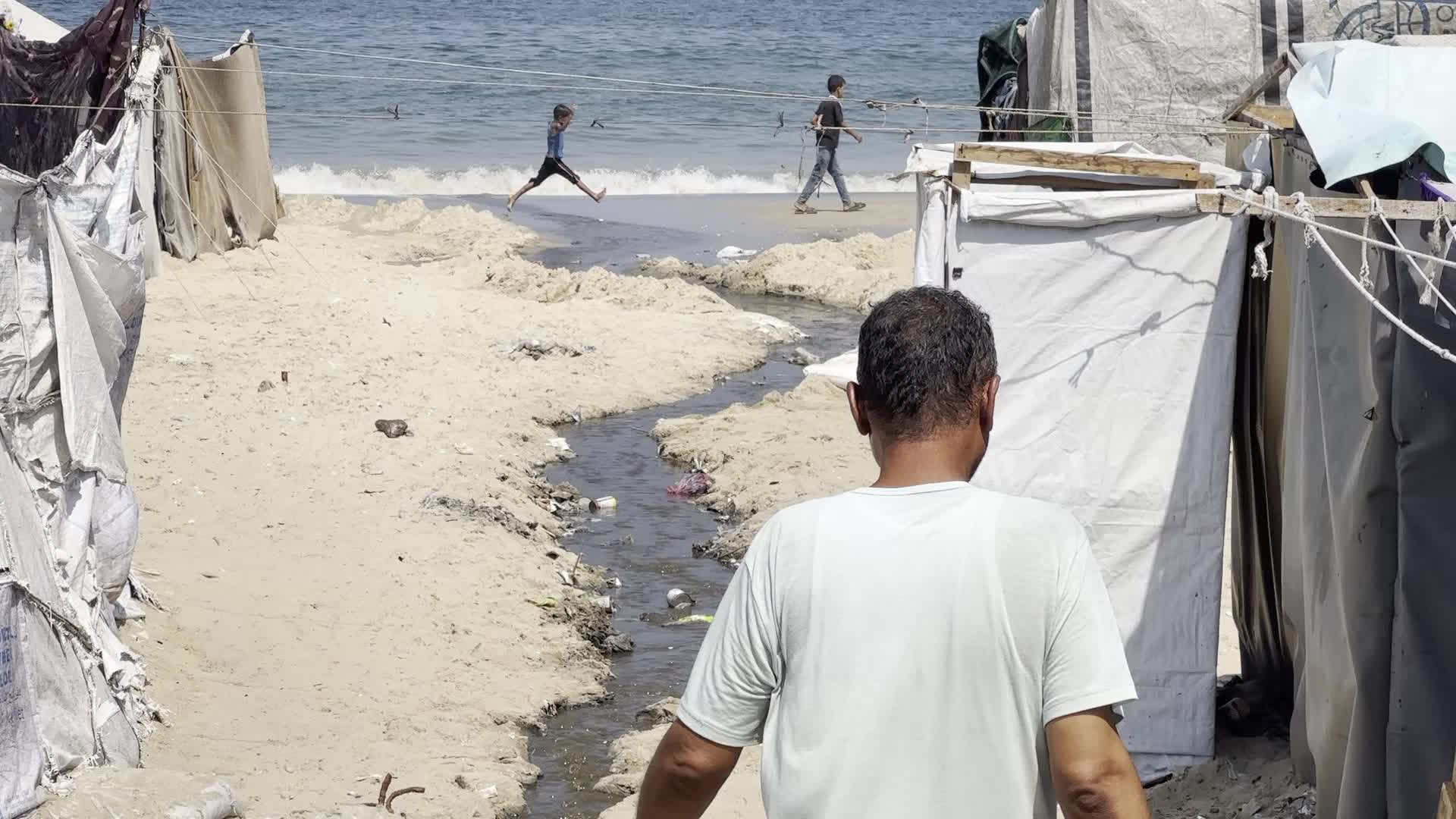 Displaced Palestinians Near Raw Sewage at Camp in Deir al-Balah, Gaza Strip