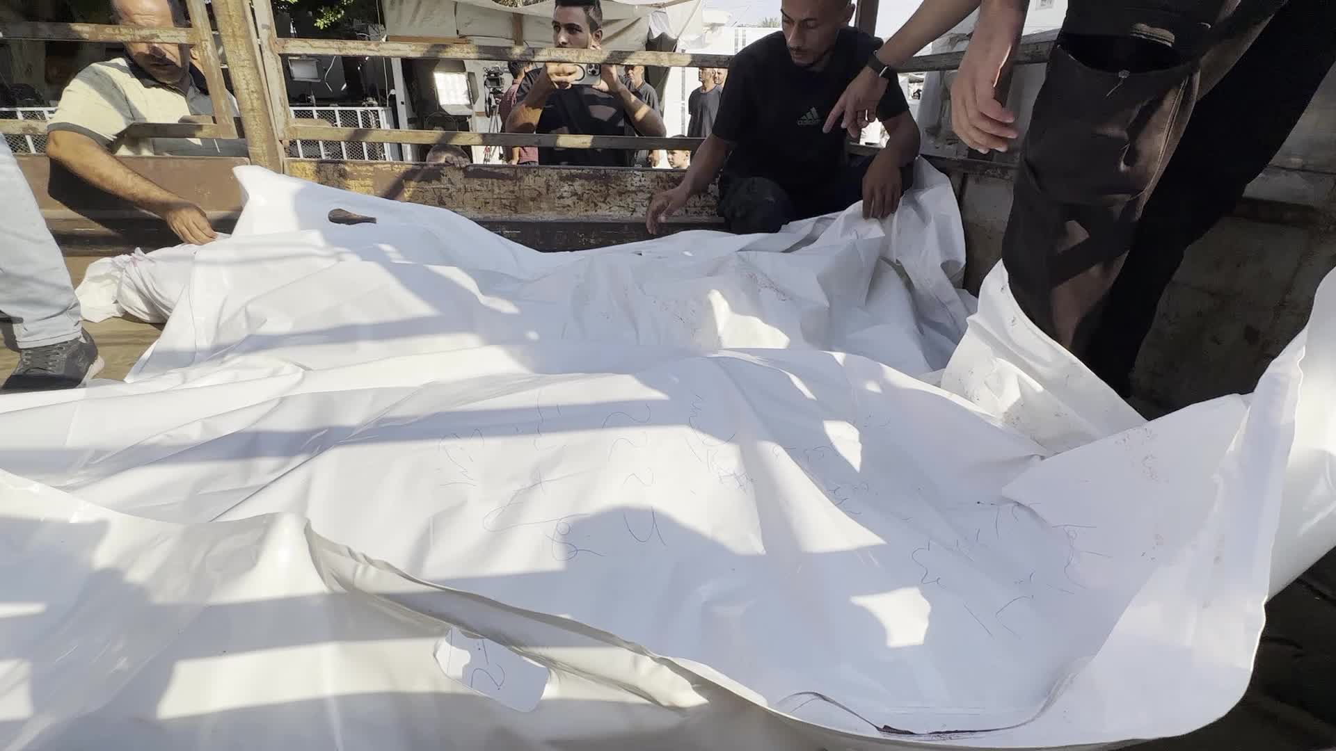 Palestinians Mourn Relatives Killed in Israeli Strike at Al-Aqsa Martyrs Hospital