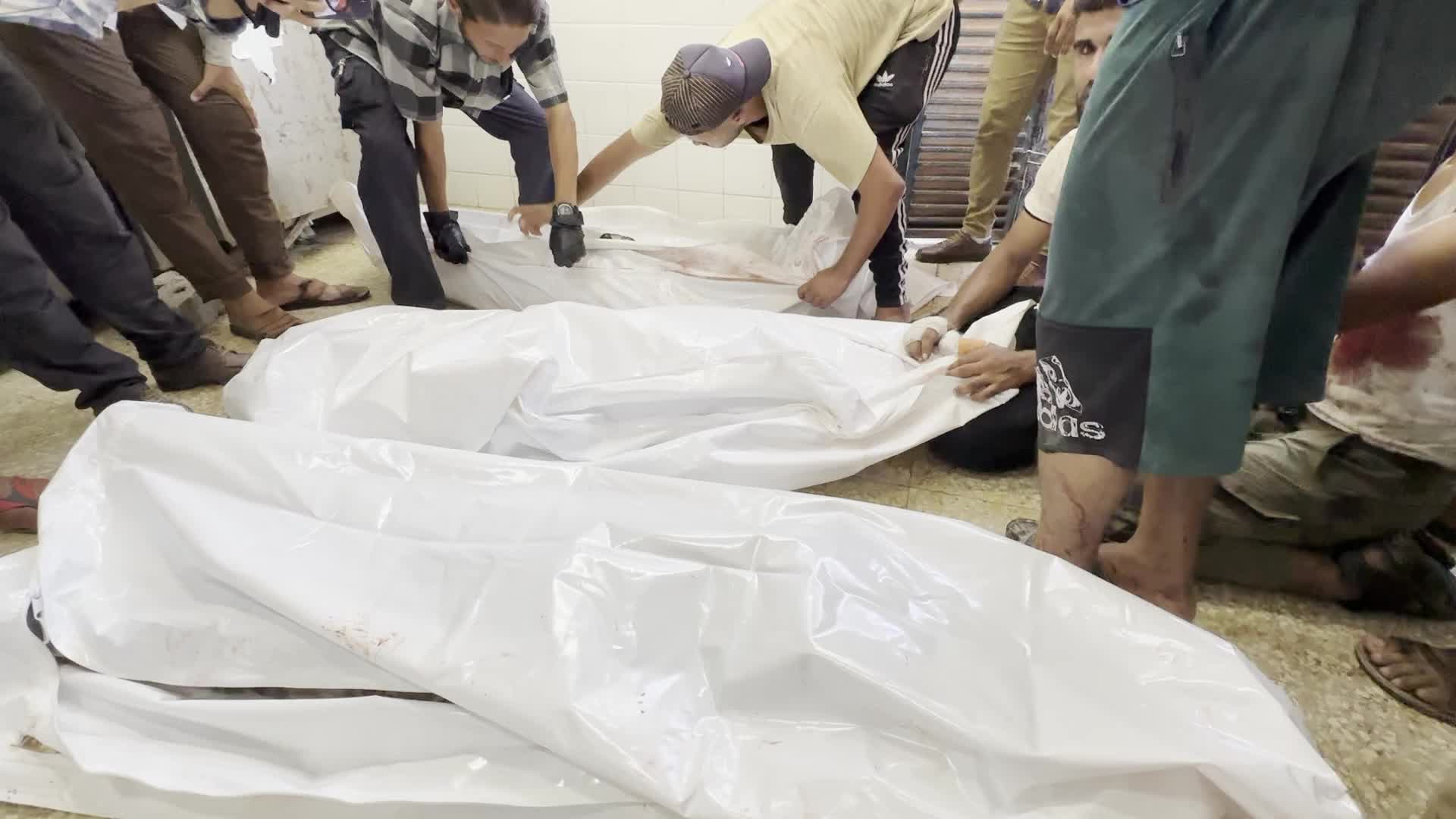 Palestinians Mourn Relatives Killed in Israeli Strike at Al-Aqsa Martyrs Hospital