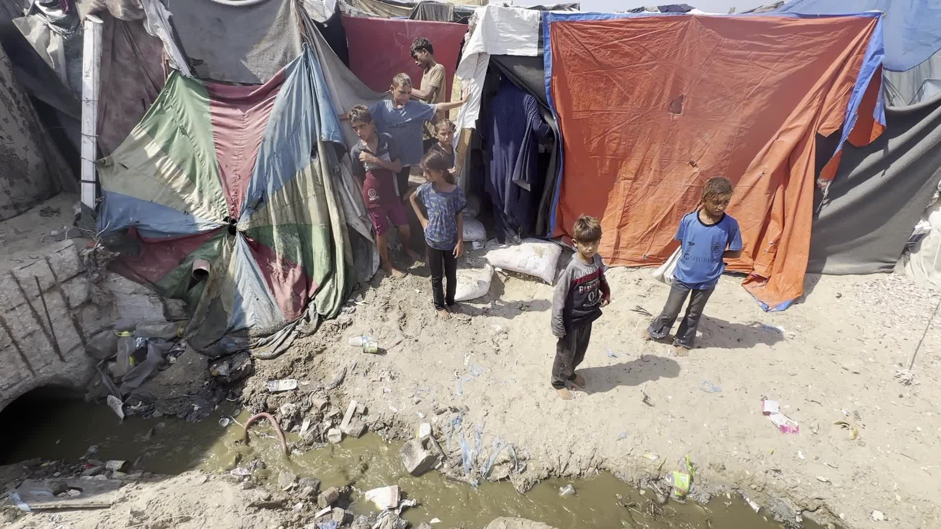 Displaced Palestinians Near Raw Sewage at Camp in Deir al-Balah, Gaza Strip