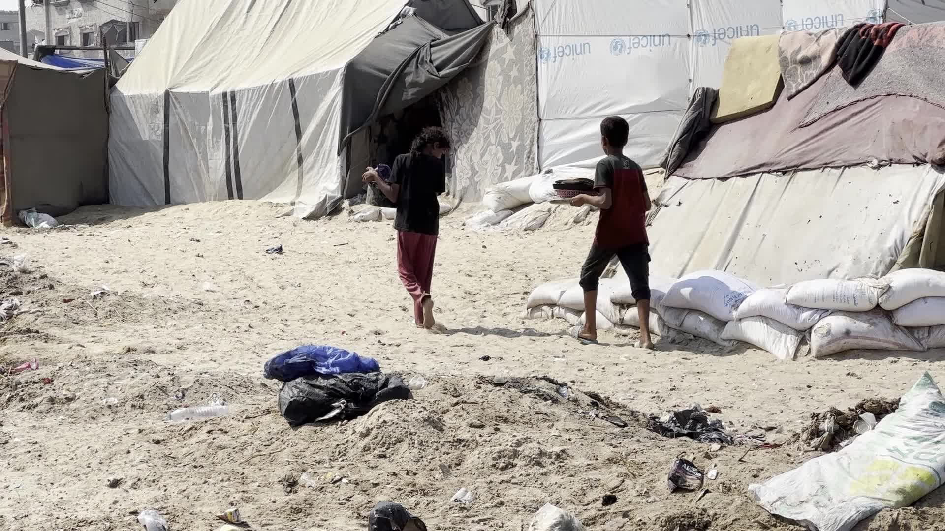 Displaced Palestinians Near Raw Sewage at Camp in Deir al-Balah, Gaza Strip
