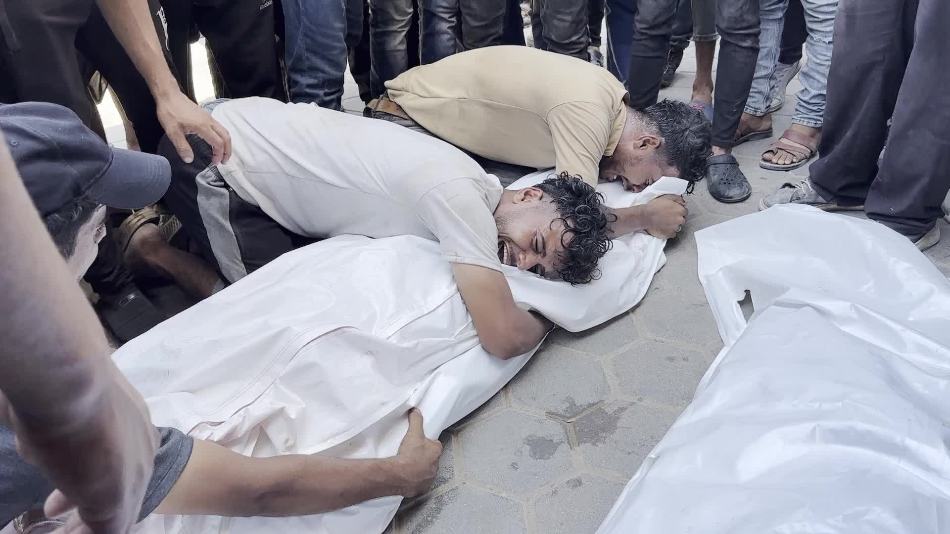 Palestinians Mourn Relatives Killed in Israeli Strike at Al-Aqsa Martyrs Hospital