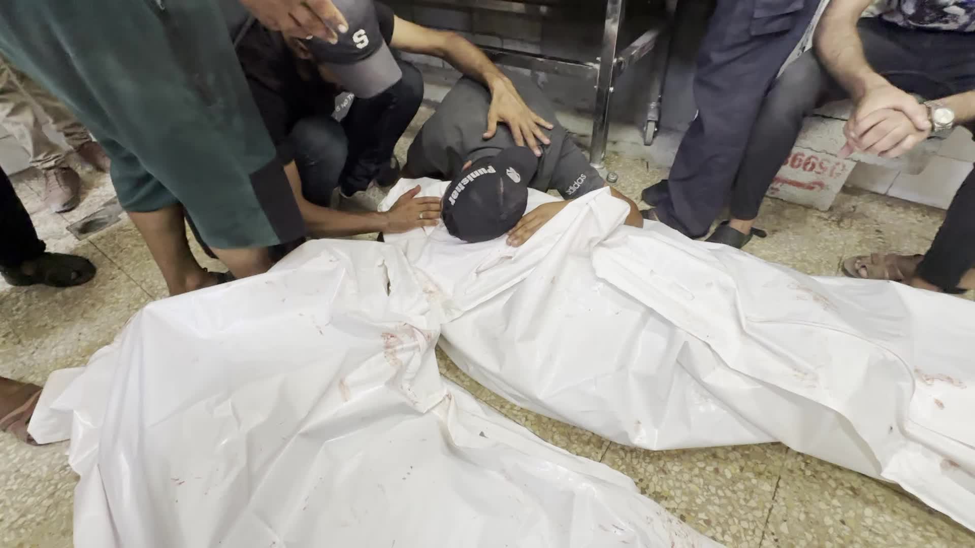 Palestinians Mourn Relatives Killed in Israeli Strike at Al-Aqsa Martyrs Hospital