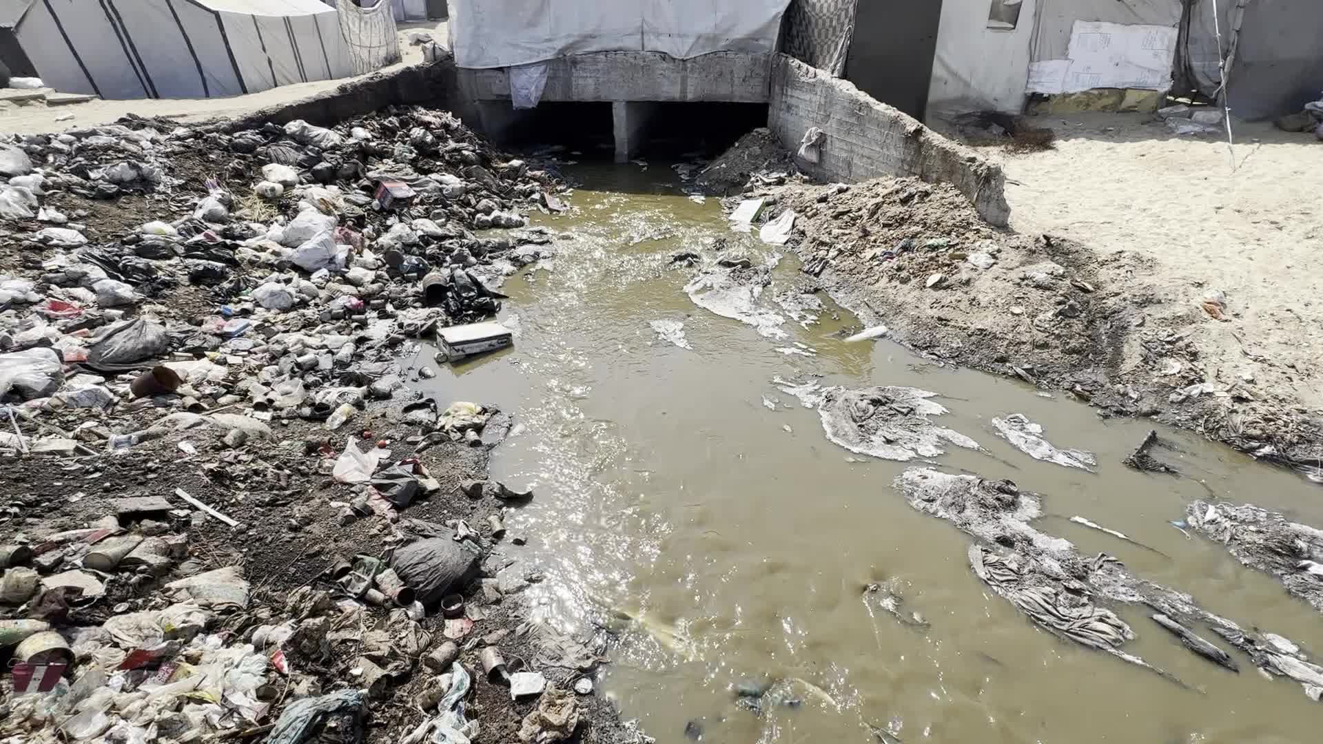 Displaced Palestinians Near Raw Sewage at Camp in Deir al-Balah, Gaza Strip