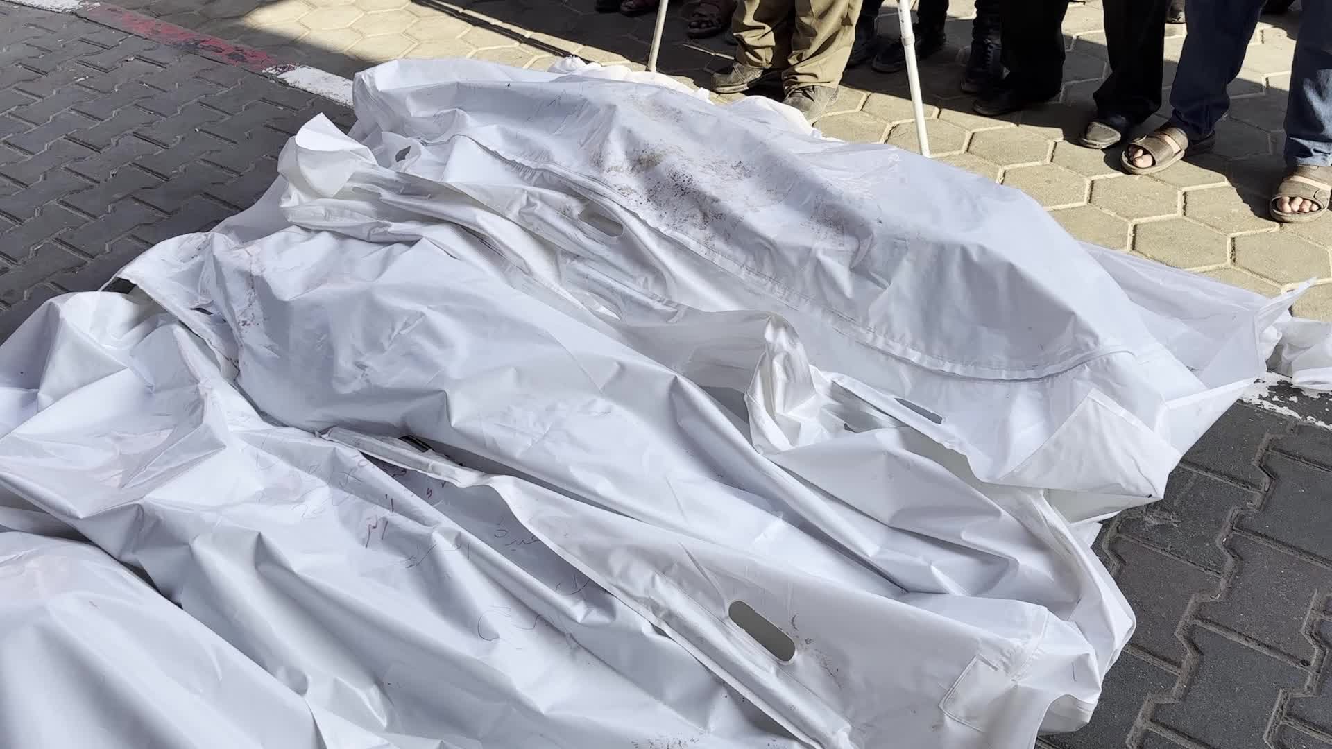Palestinians Mourn Relatives Killed in Israeli Strike at Al-Aqsa Martyrs Hospital